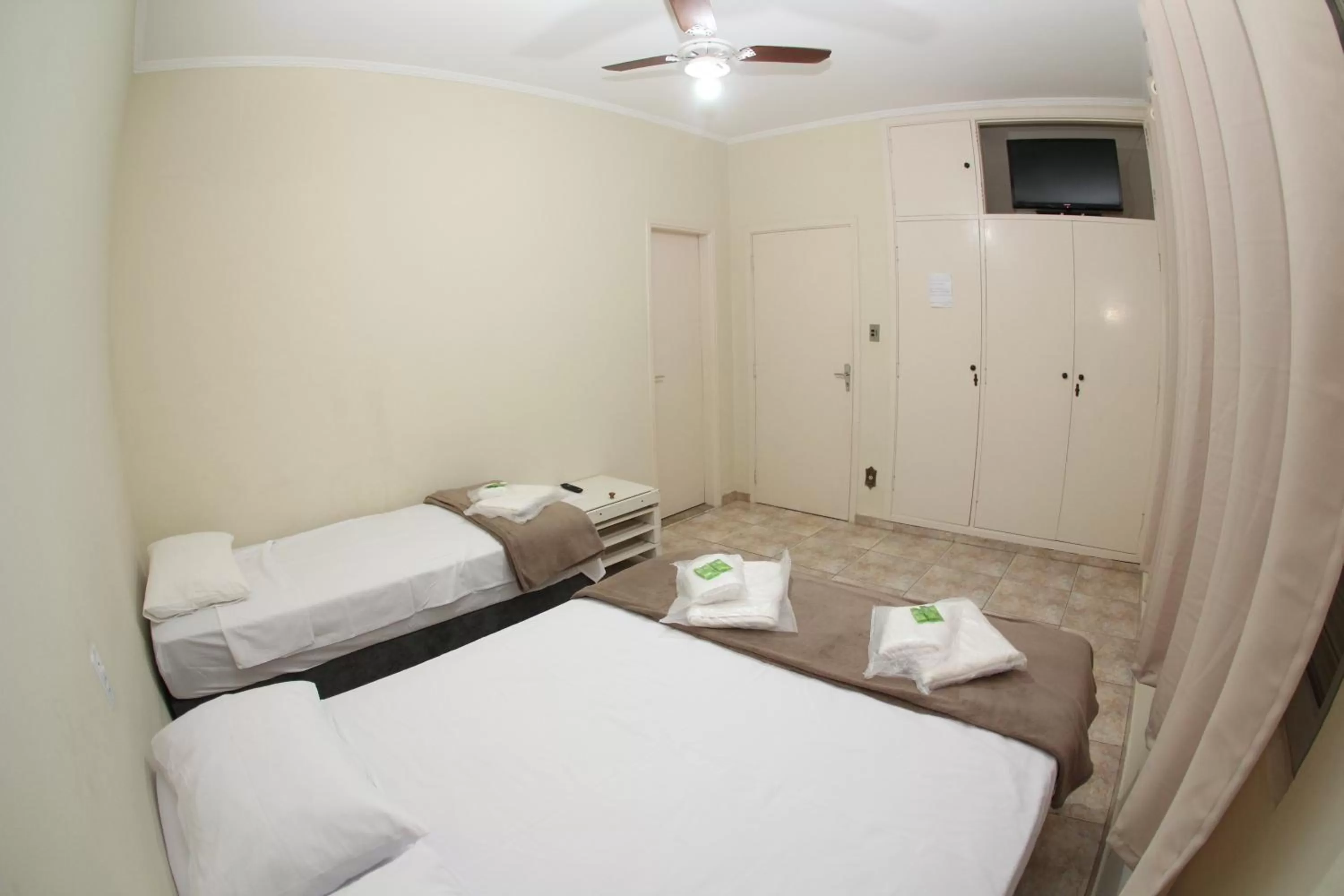 Bed in Pousada Santa Genebra