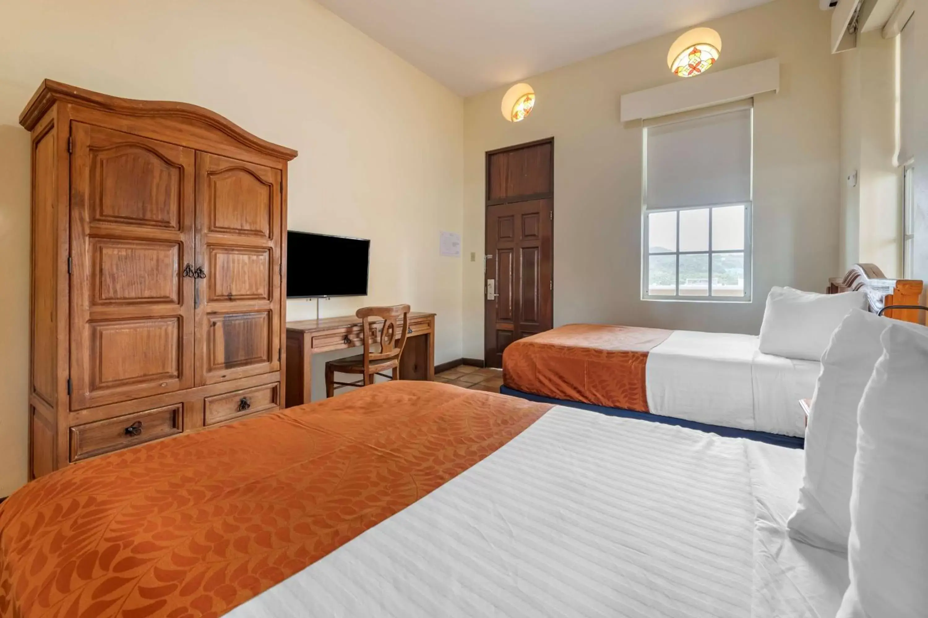 Bedroom, Bed in Mayaguez Plaza Hotel; SureStay Collection by Best Western