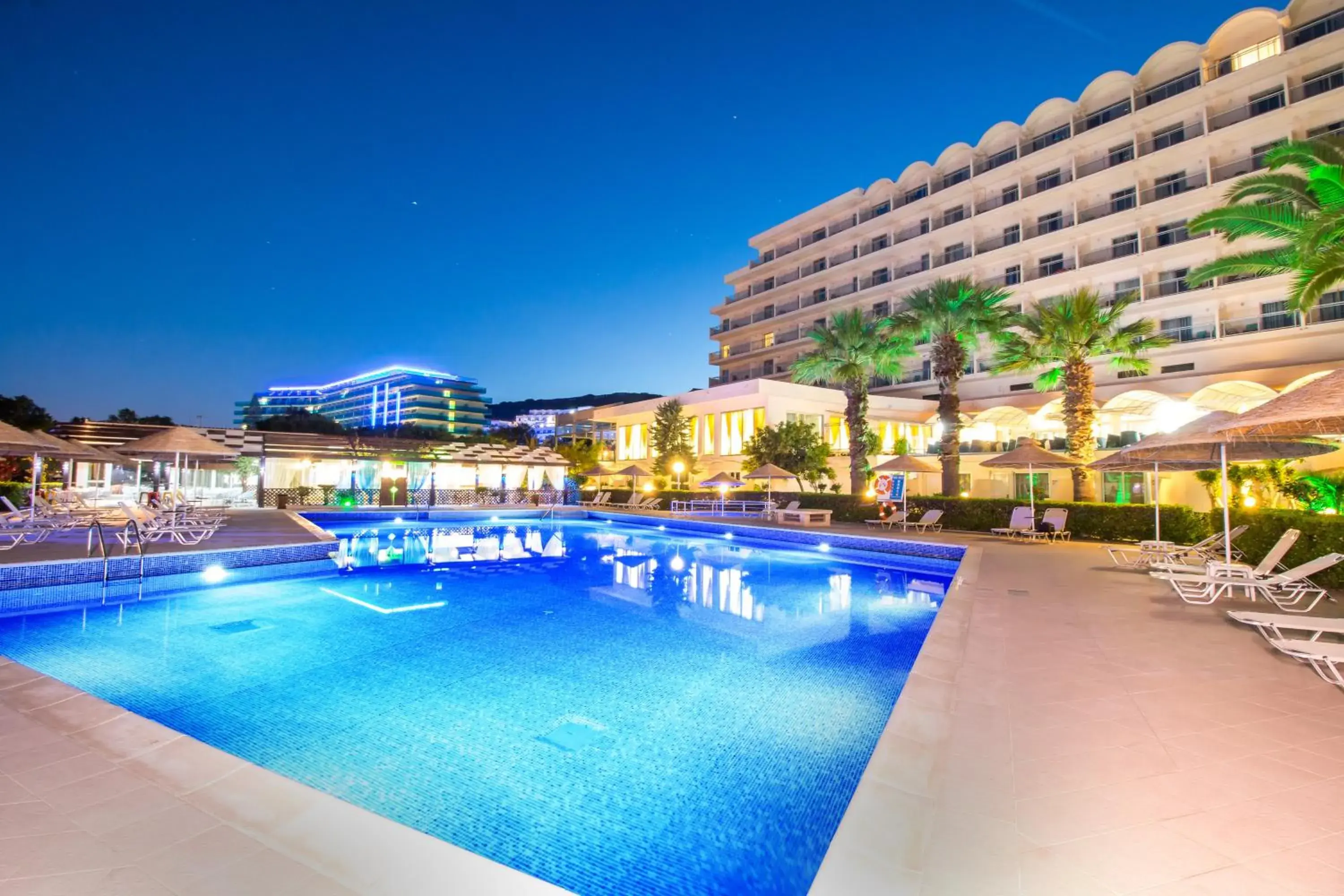 Swimming pool, Property Building in Pegasos Deluxe Beach Hotel