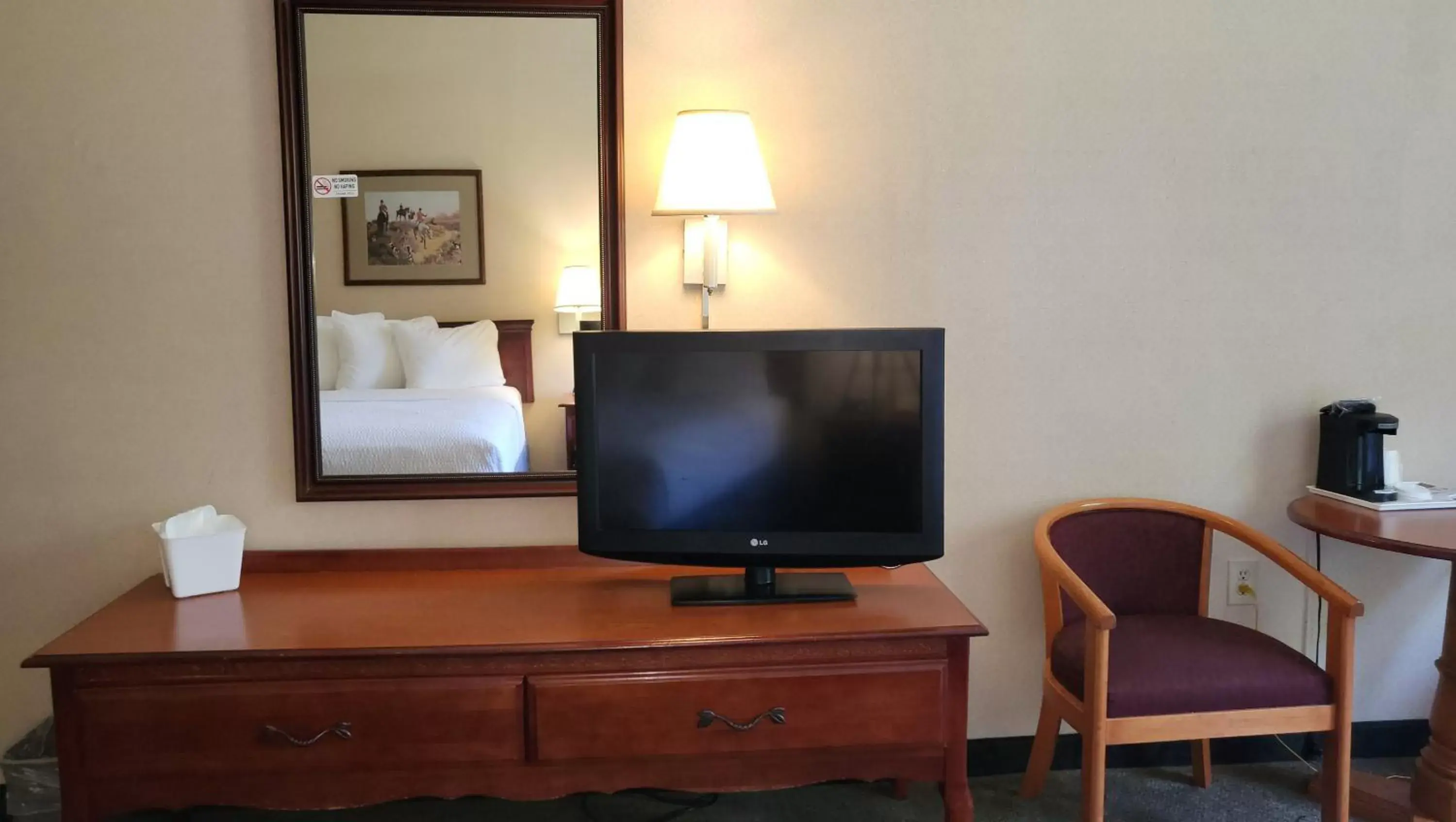 Photo of the whole room, TV/Entertainment Center in Magnuson Hotel West Liberty