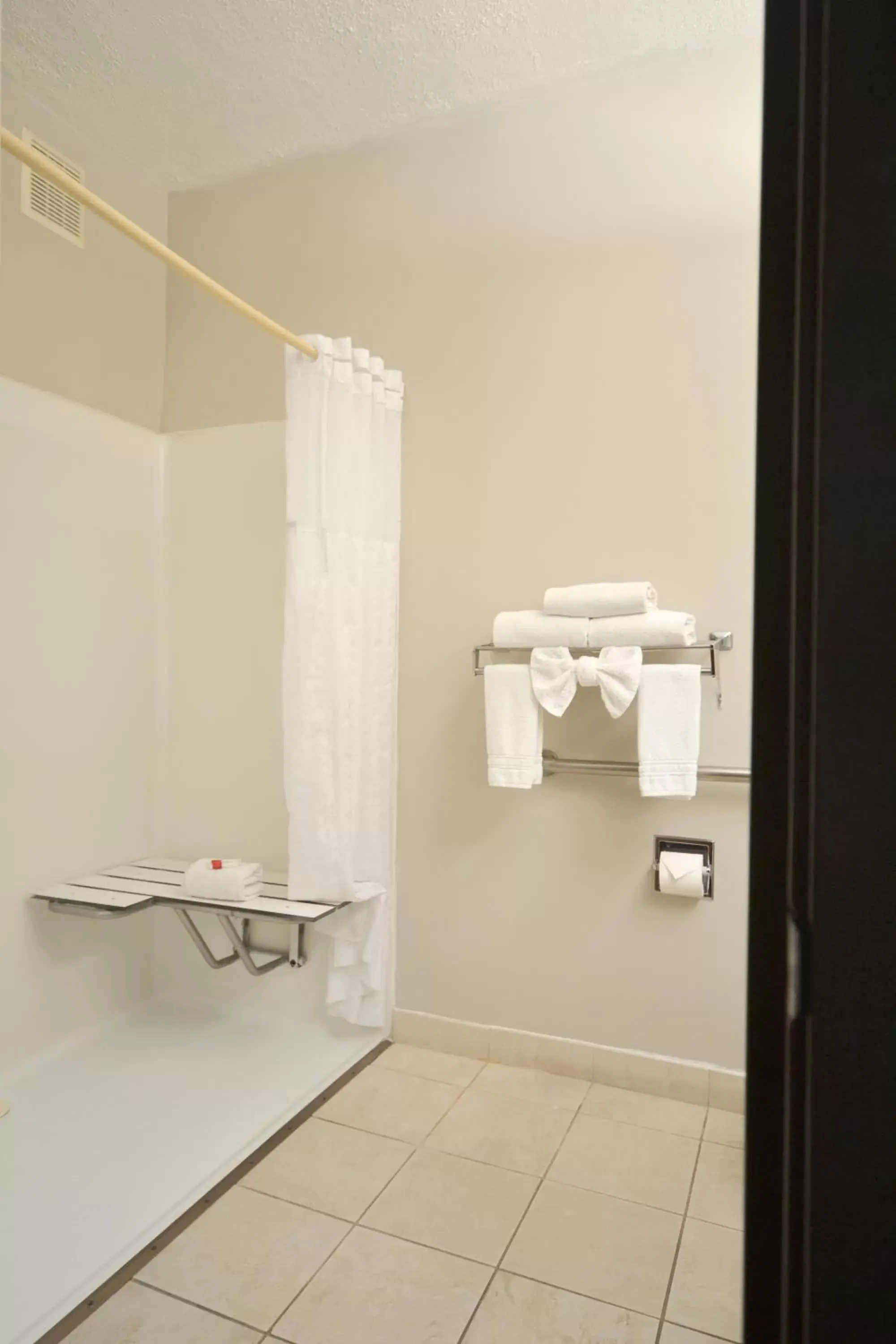 Bathroom in Days Inn & Suites by Wyndham Airport Albuquerque