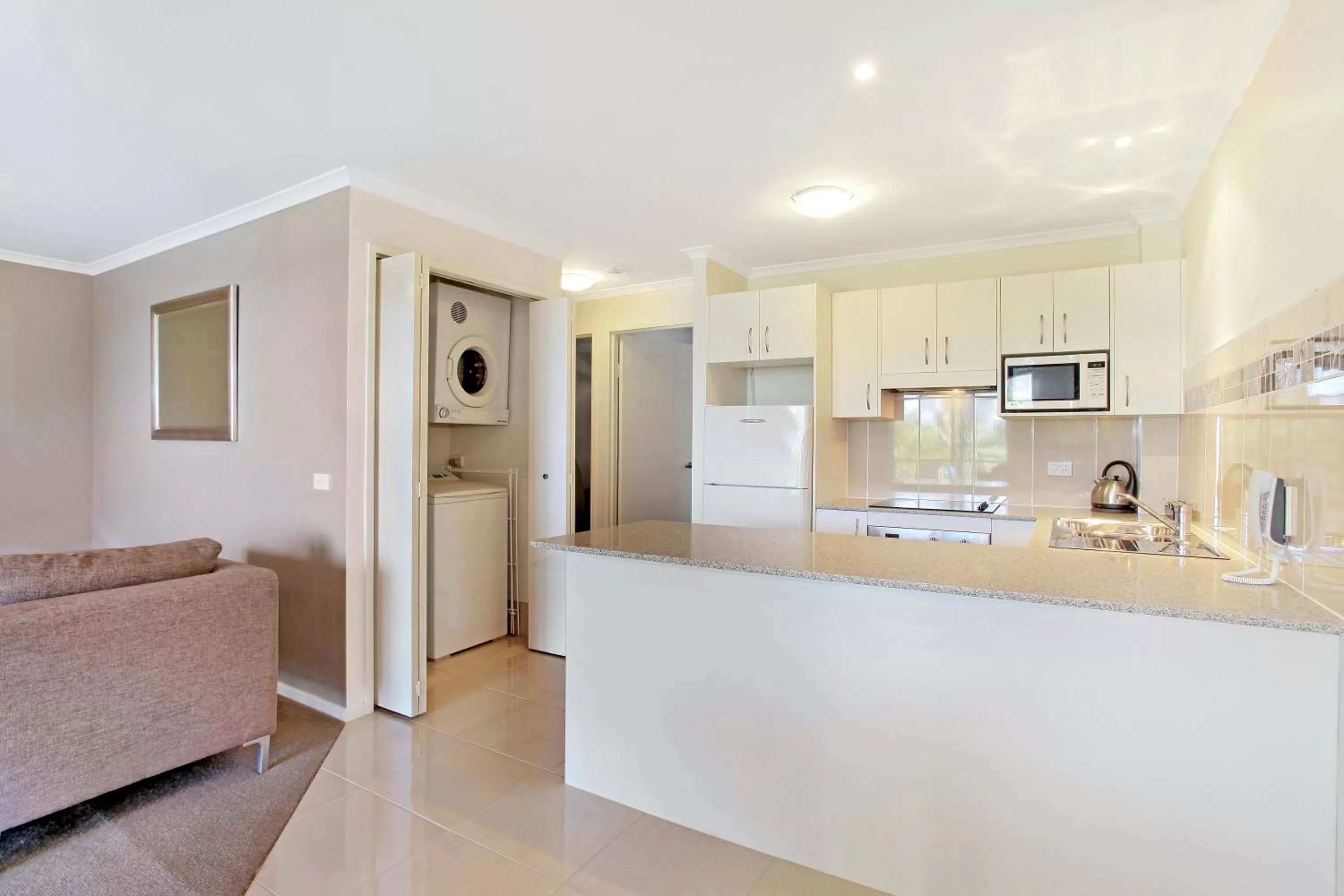 Kitchen or kitchenette in South Pacific Apartments