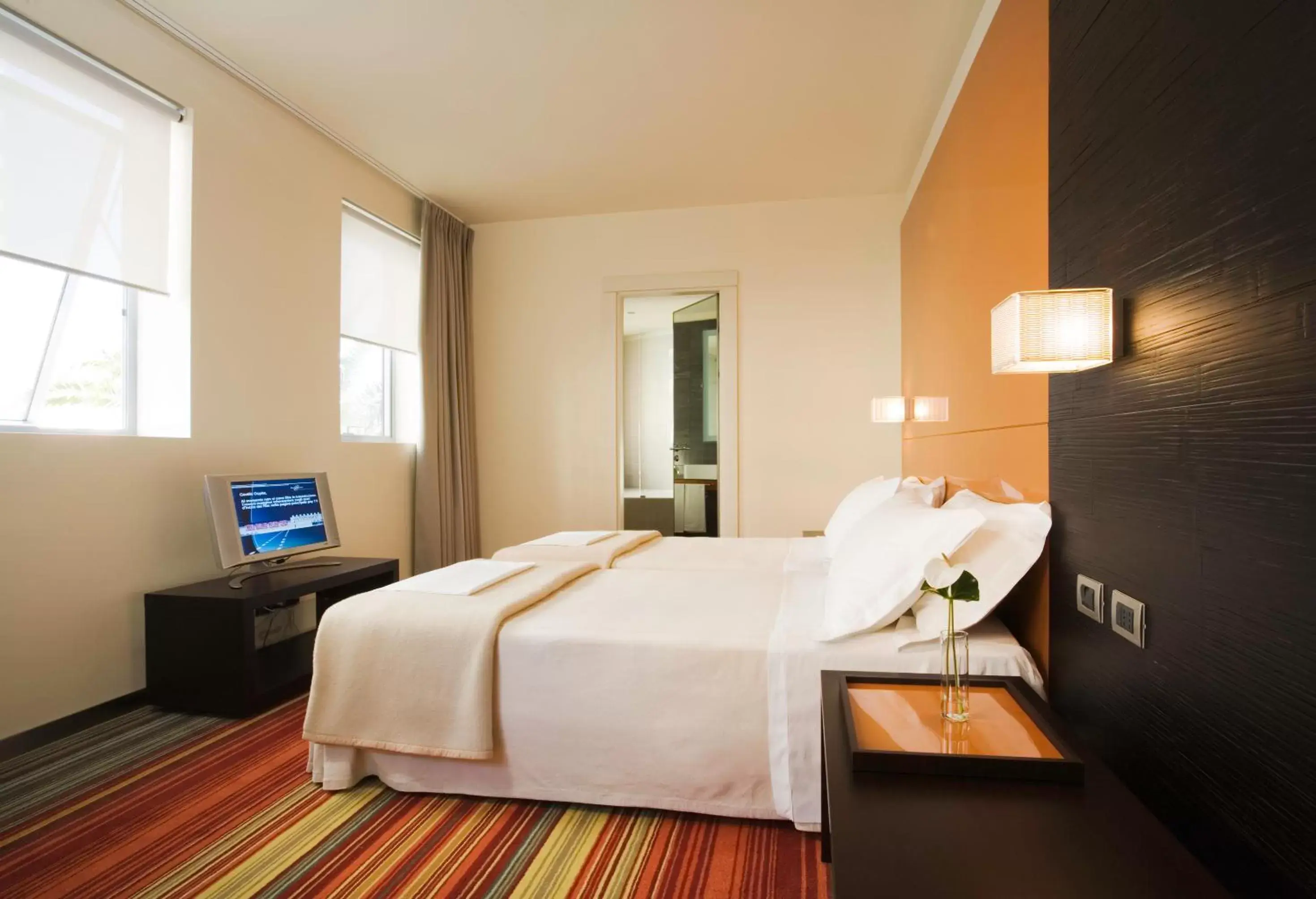 Bed in UNAHOTELS T Hotel Cagliari