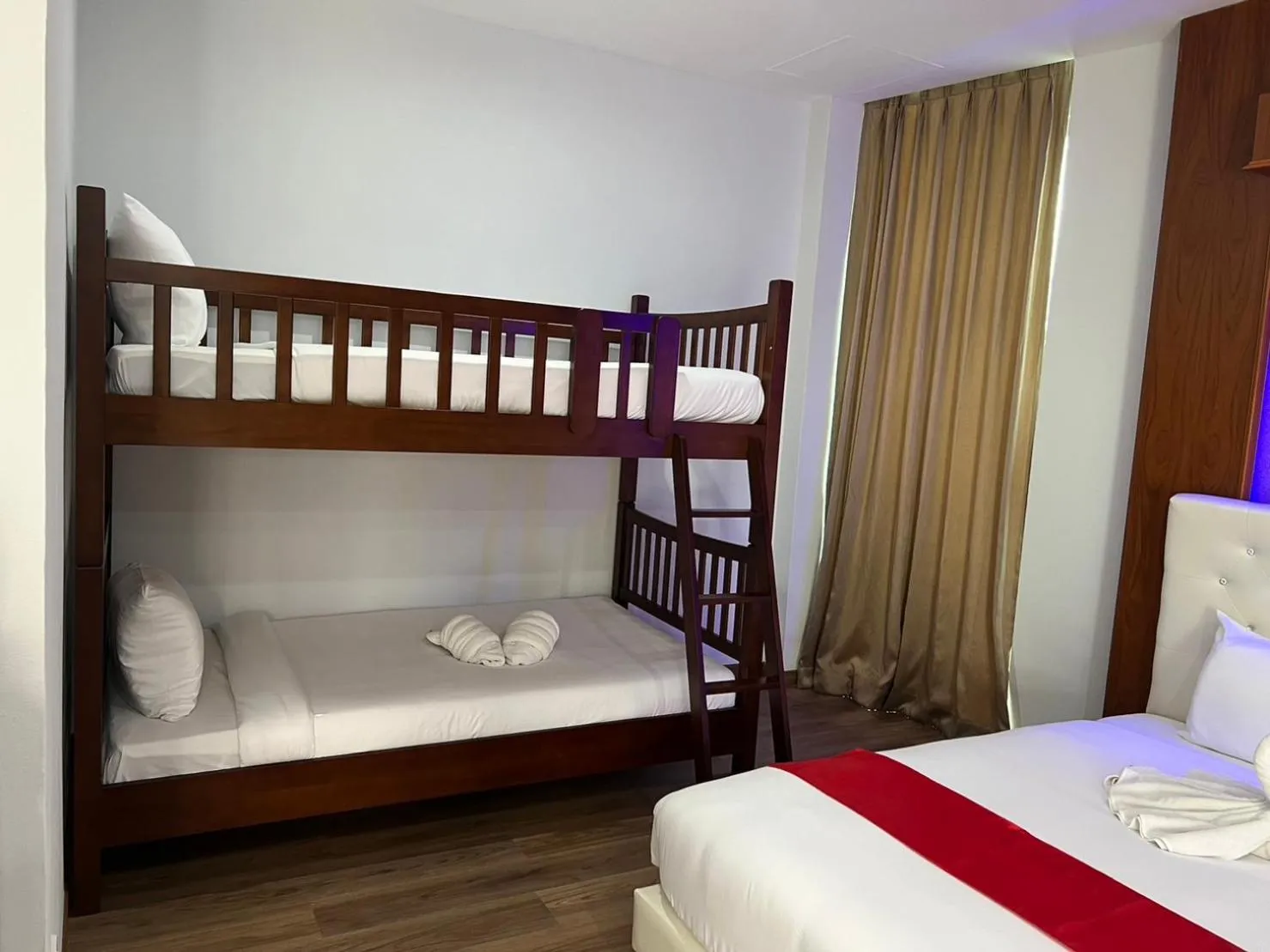 Bed in River Grand Hotel