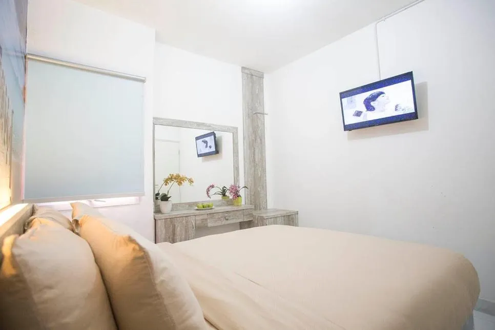 Bed in De Green Inn at Aeropolis