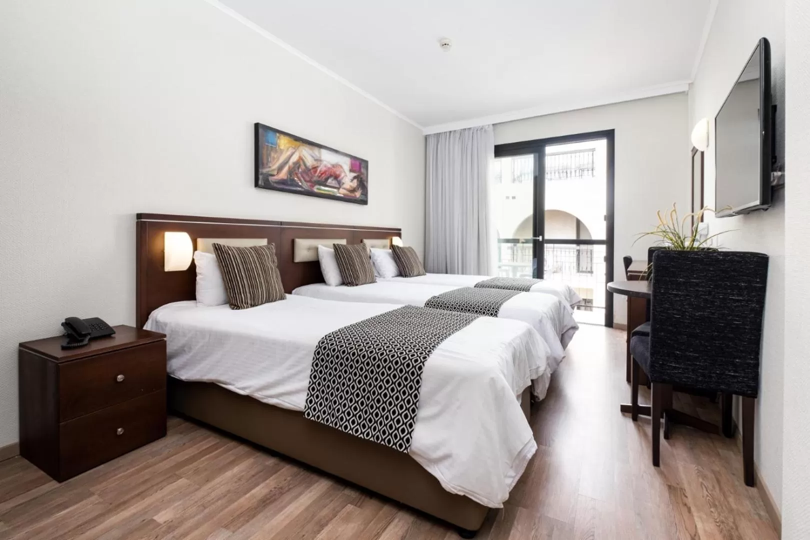 Bed in Livadhiotis City Hotel