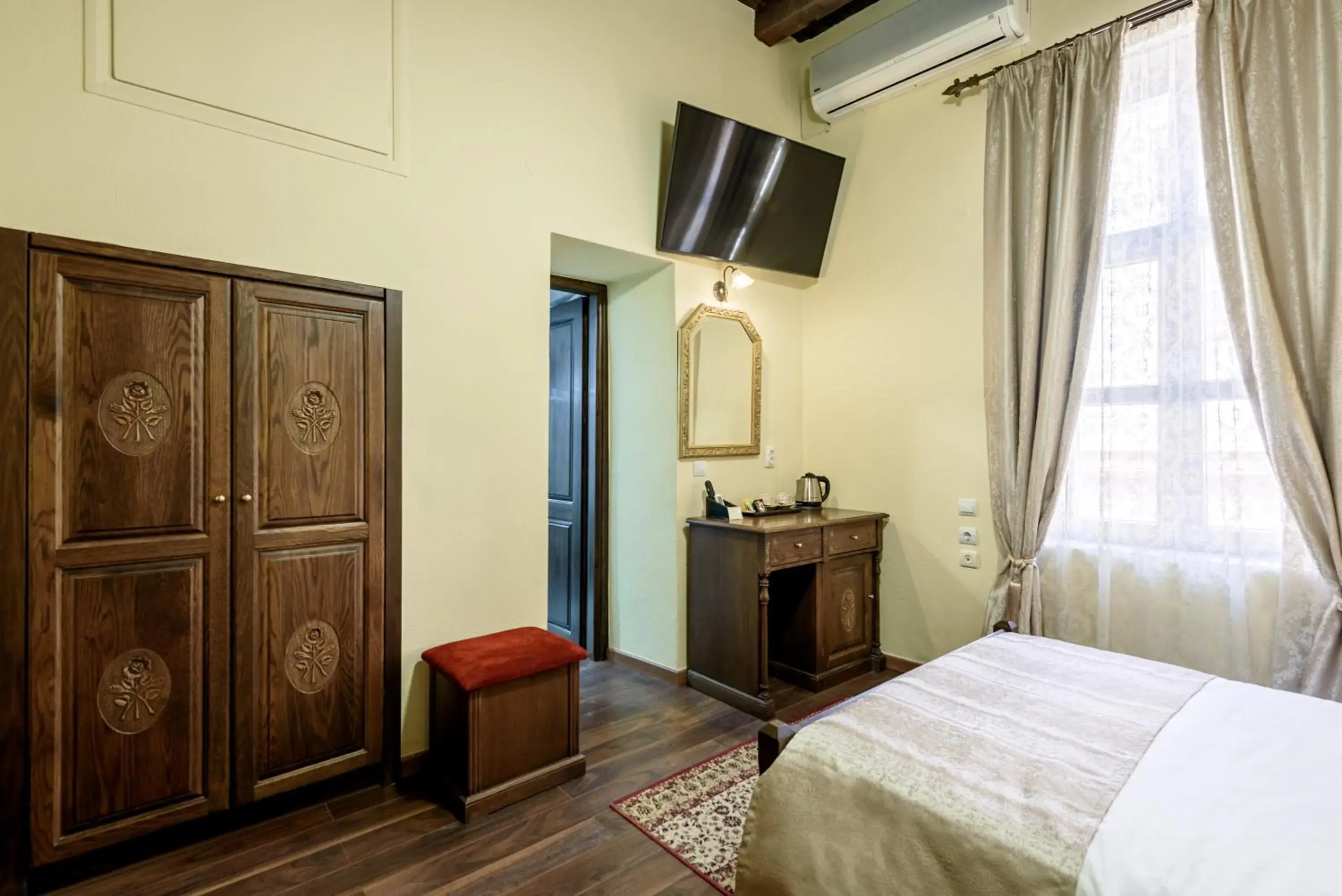 Photo of the whole room, Bed in Porto Del Colombo Traditional Boutique Hotel