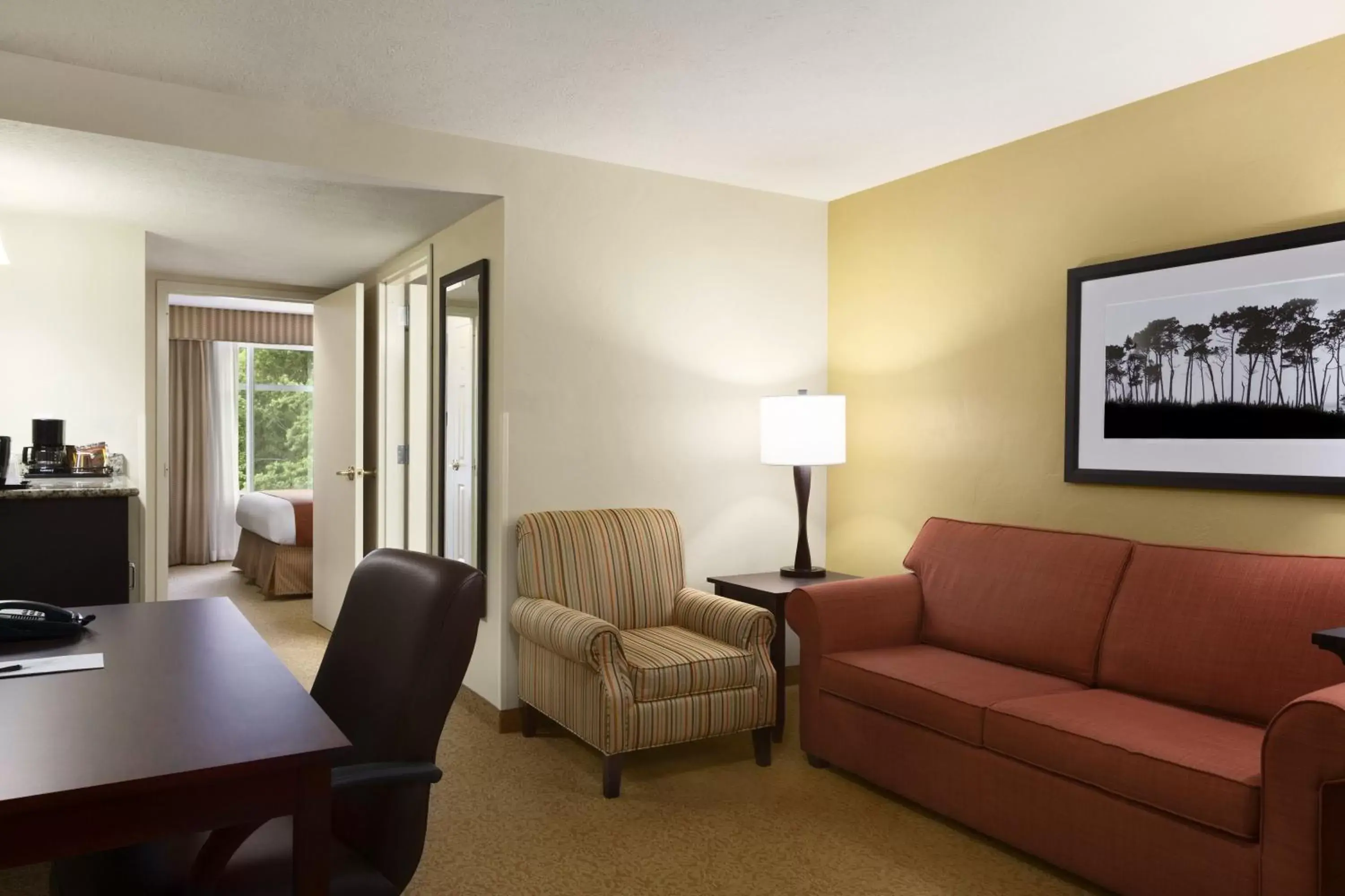 Living room, Seating Area in Country Inn & Suites by Radisson, Port Charlotte, FL