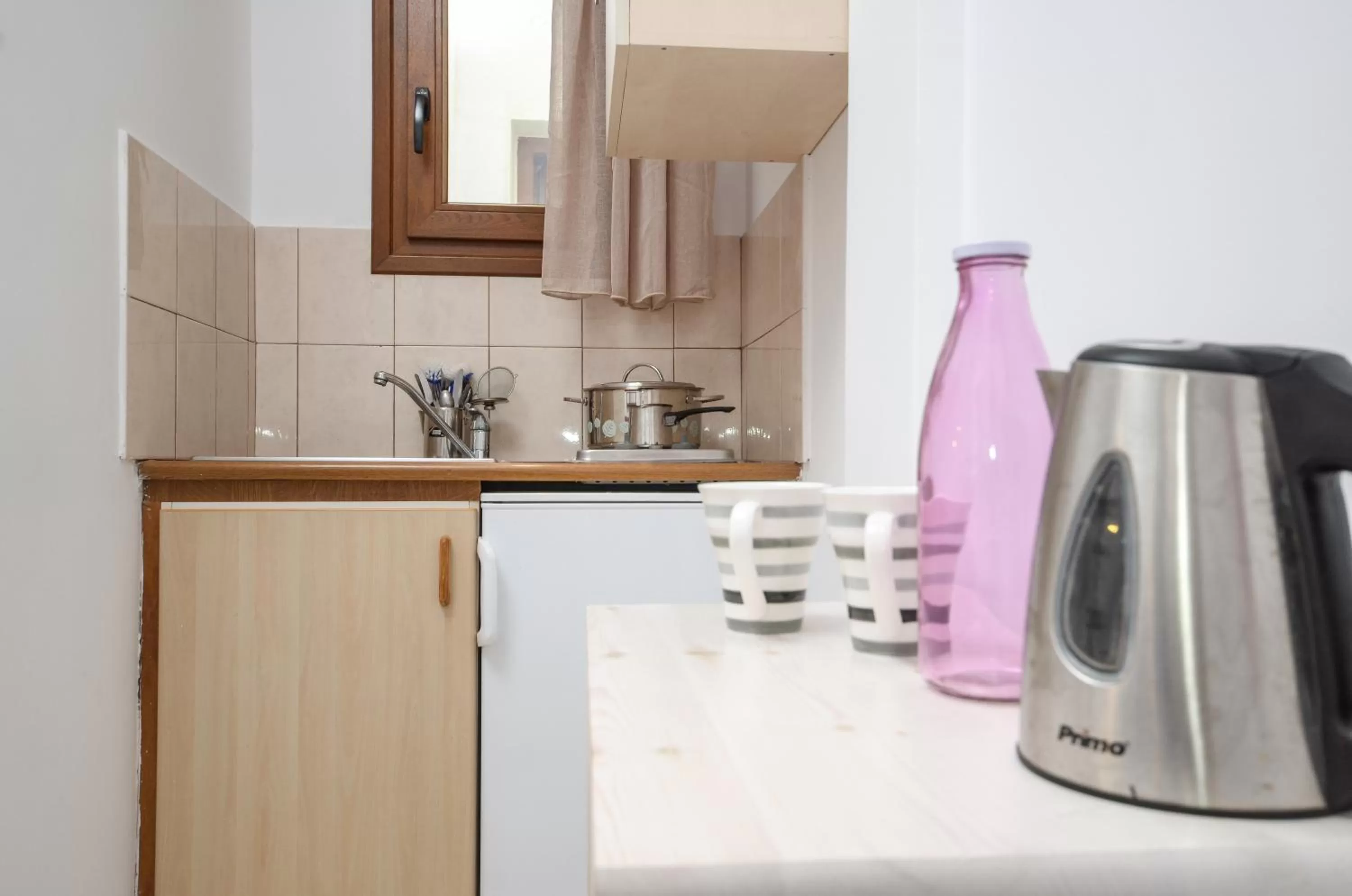 Kitchen or kitchenette in Panormos Hotel and Studios