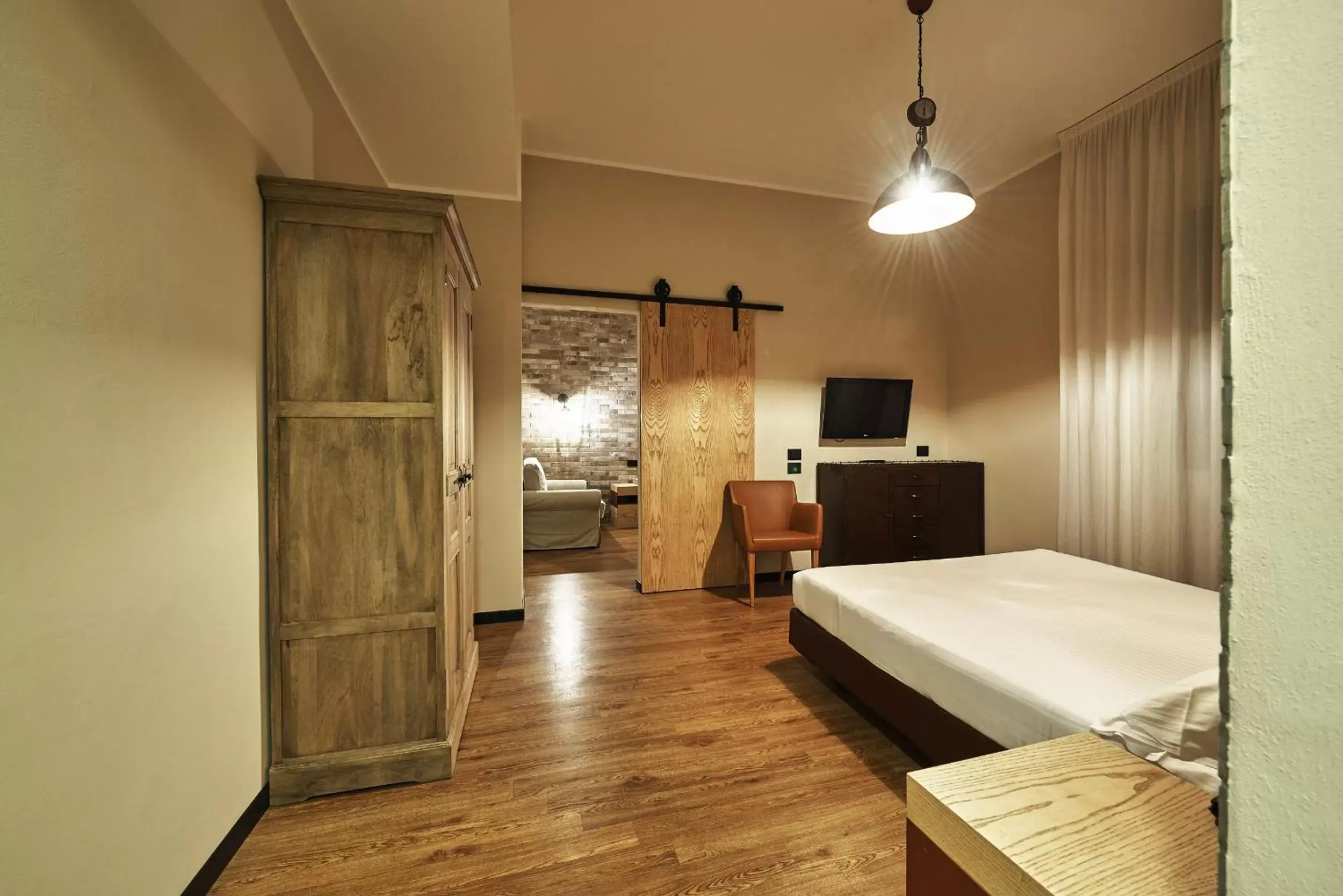 Bedroom, TV/Entertainment Center in Hotel Miramonti