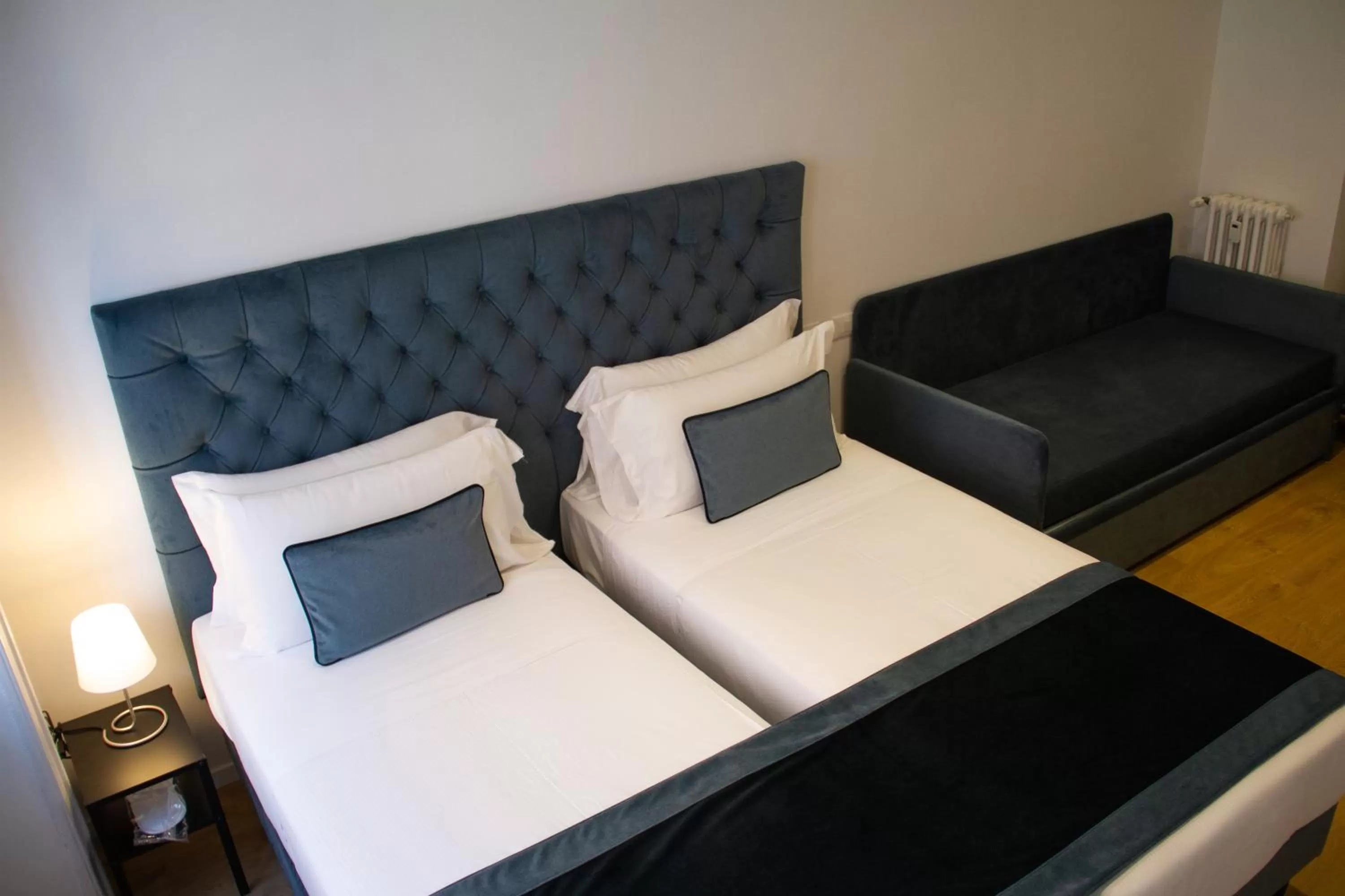 Bed in Michelangelo Vatican Rooms