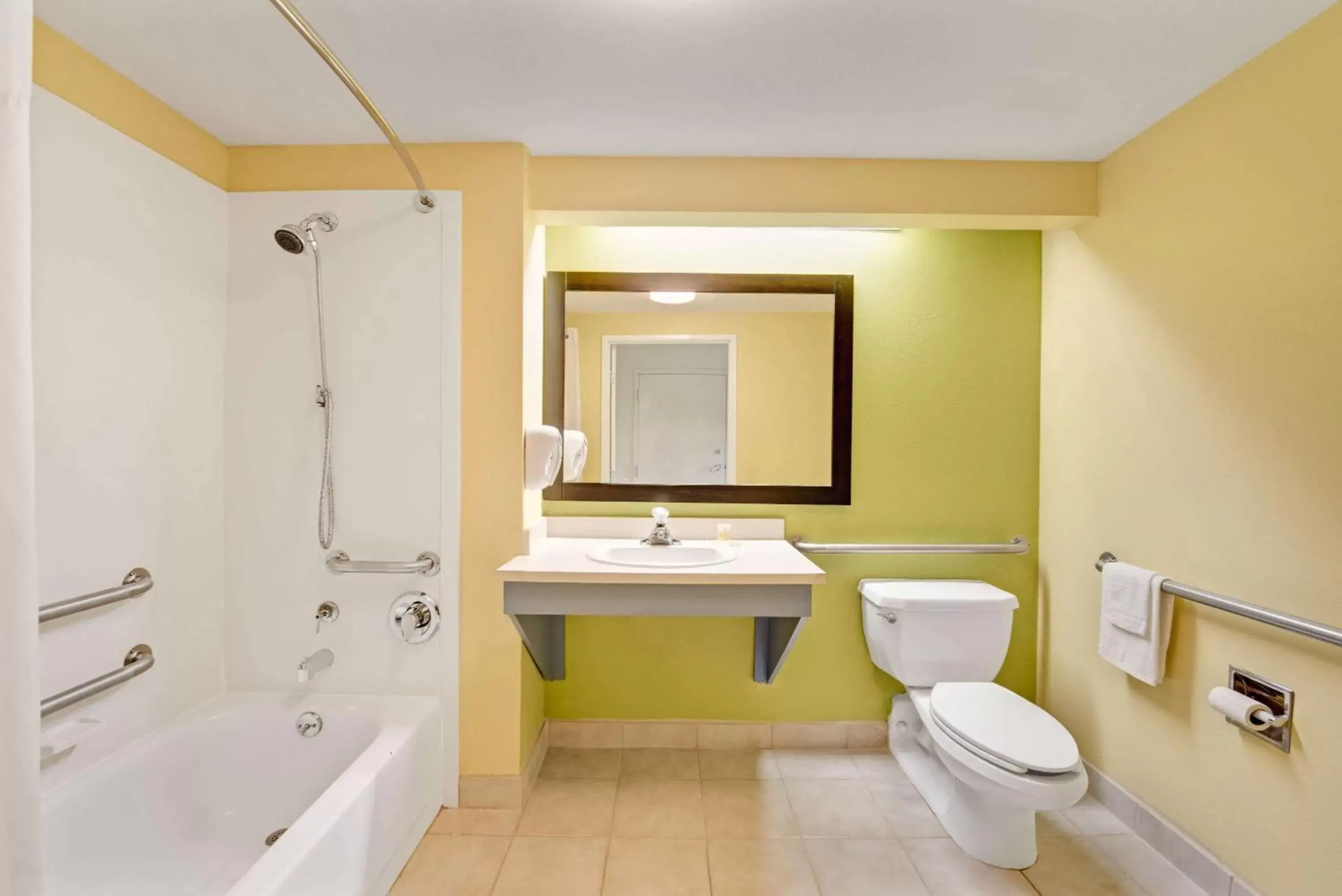 Bathroom in Days Inn & Suites by Wyndham DeSoto