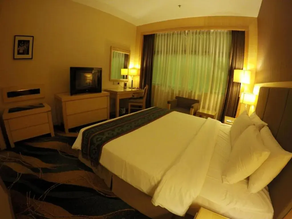 Bed in Imperial Palace Hotel