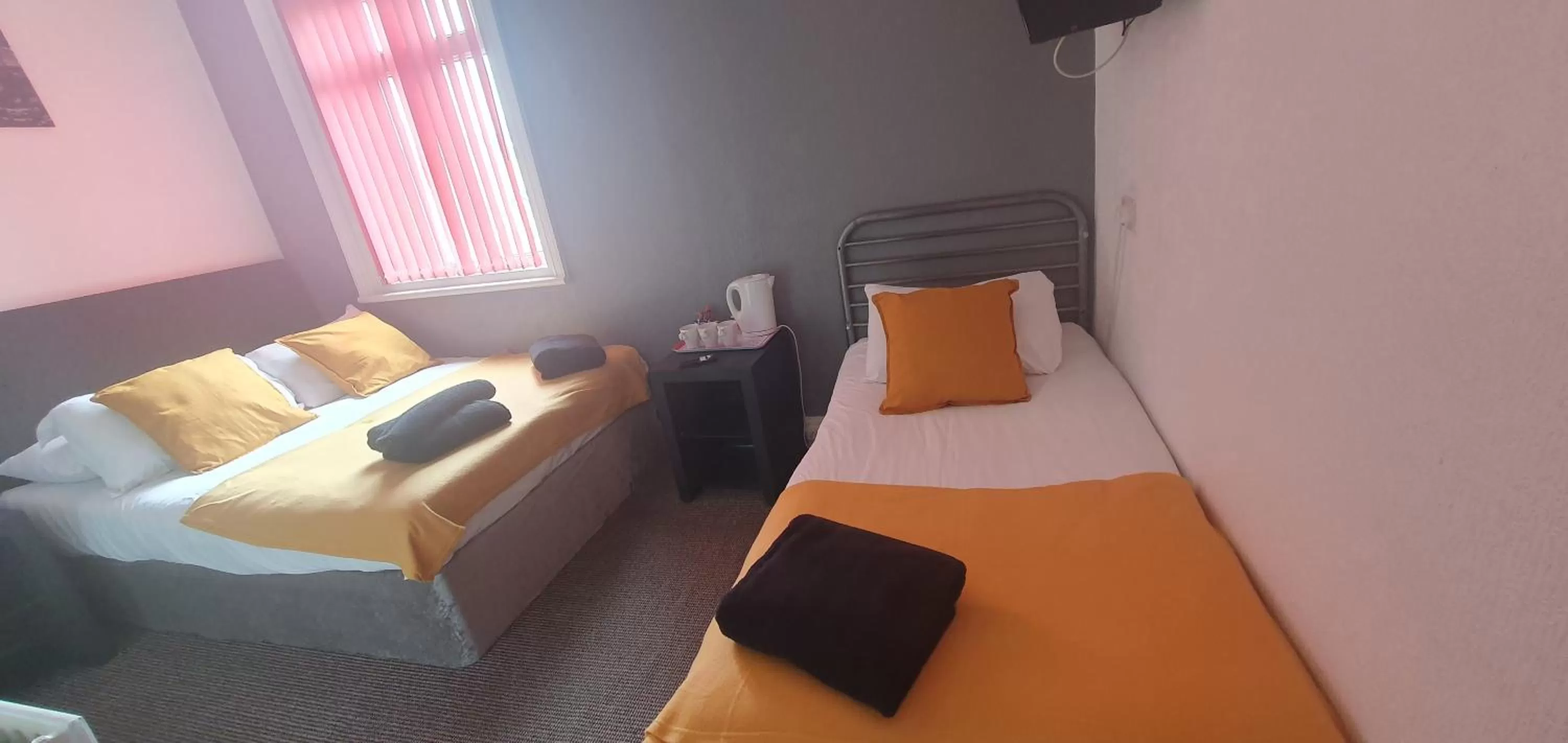 Bed in Palm Beach Hotel by the Sea