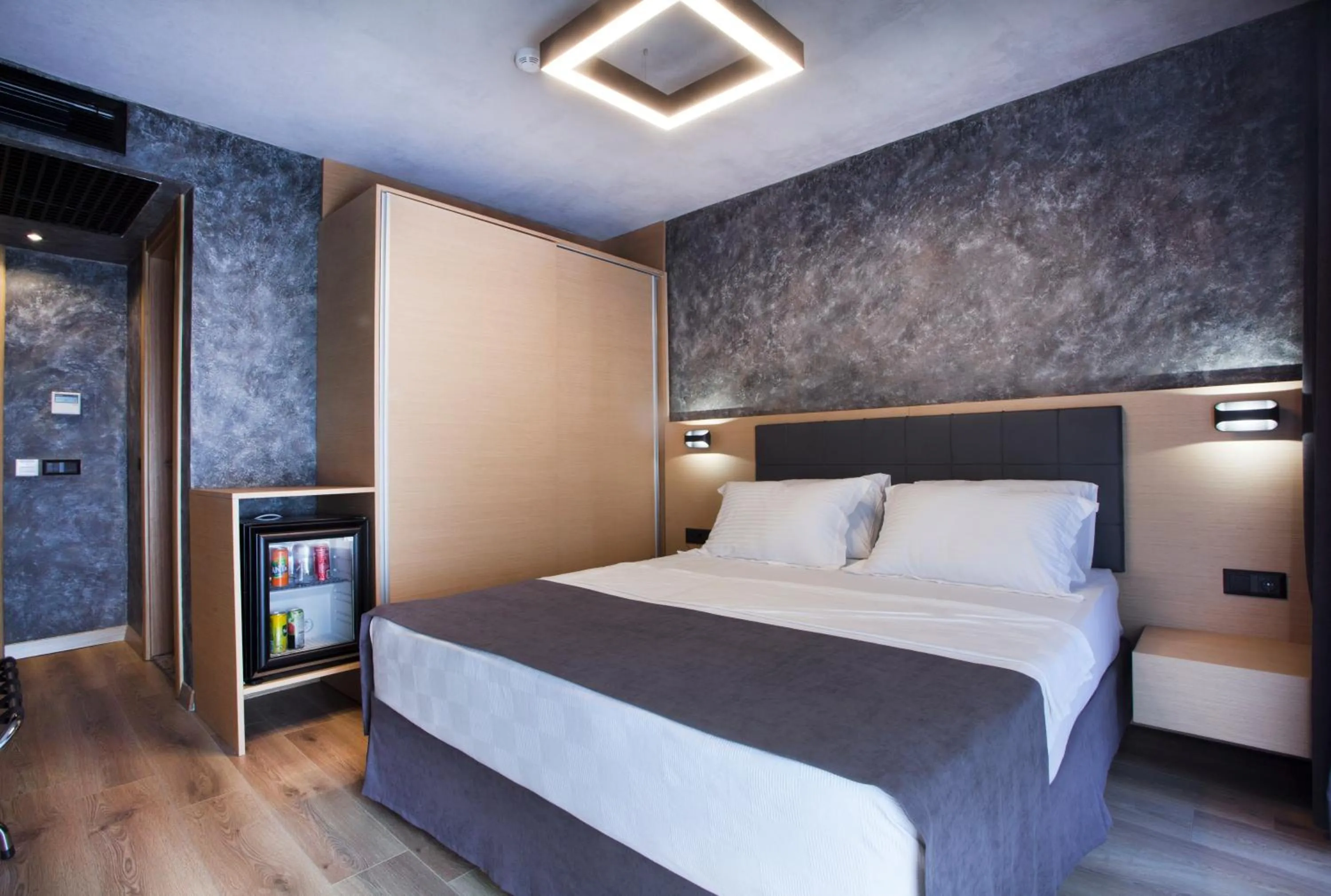 Bed in Red Stone Hotel