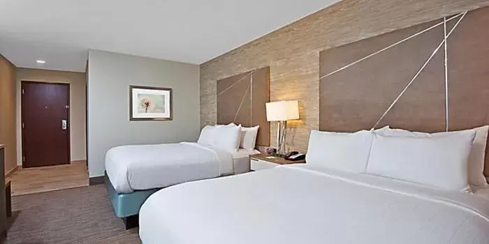 Bed in Holiday Inn Express & Suites New Cumberland, an IHG Hotel