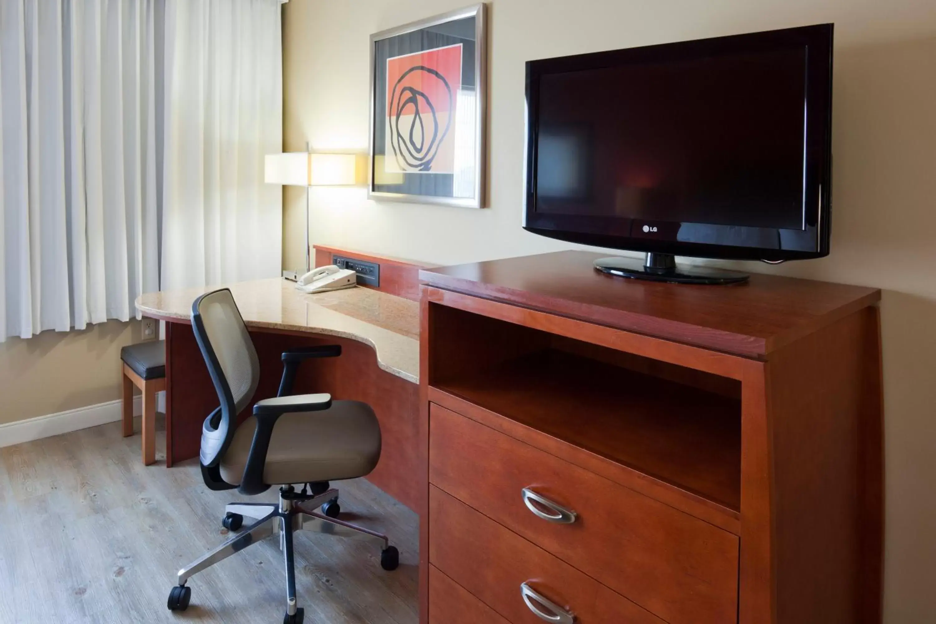 Photo of the whole room, TV/Entertainment Center in Holiday Inn Hotel & Suites Maple Grove Northwest Minneapolis-Arbor Lakes, an IHG Hotel