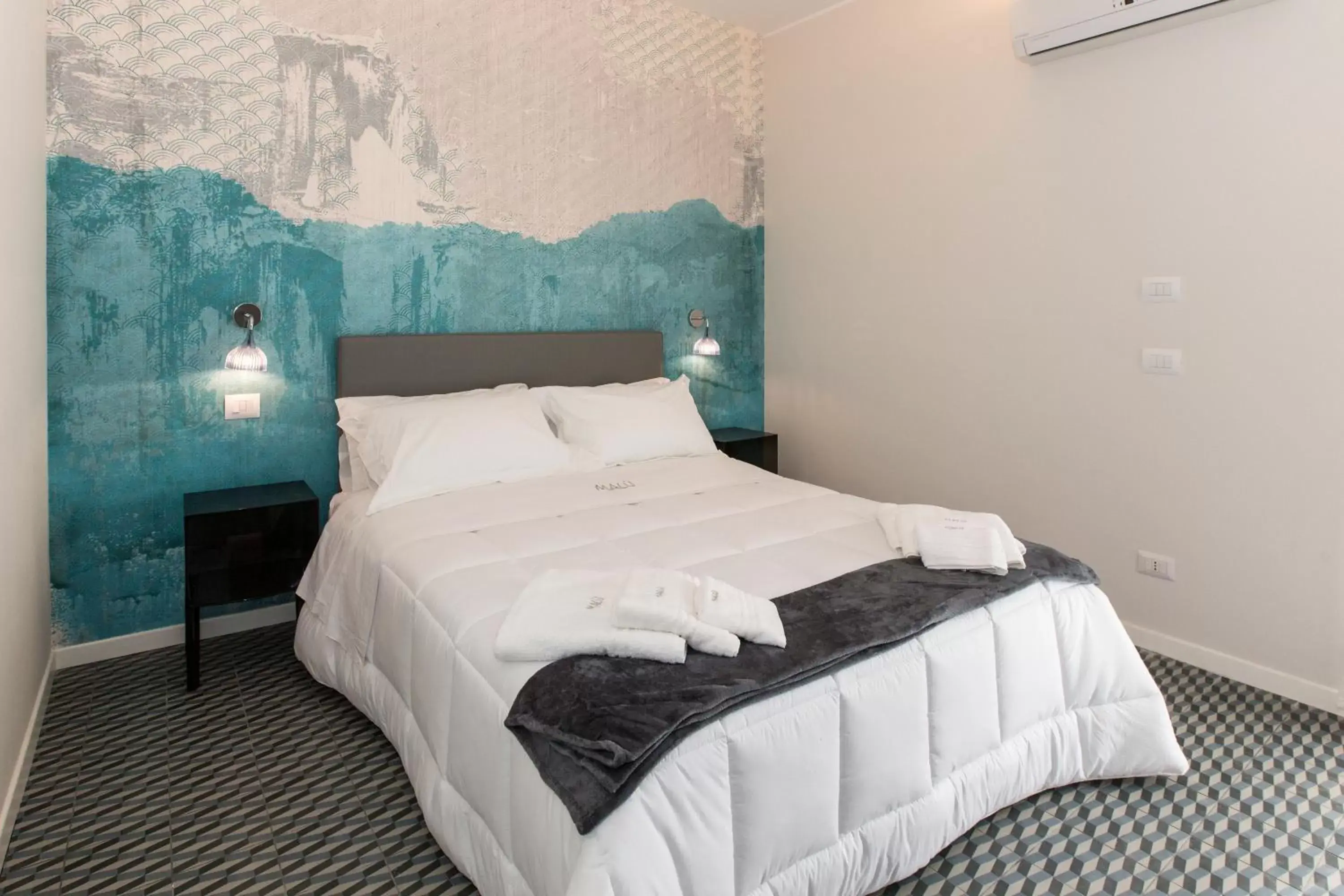 Bed in Malù Suites Bed in Malù Suites