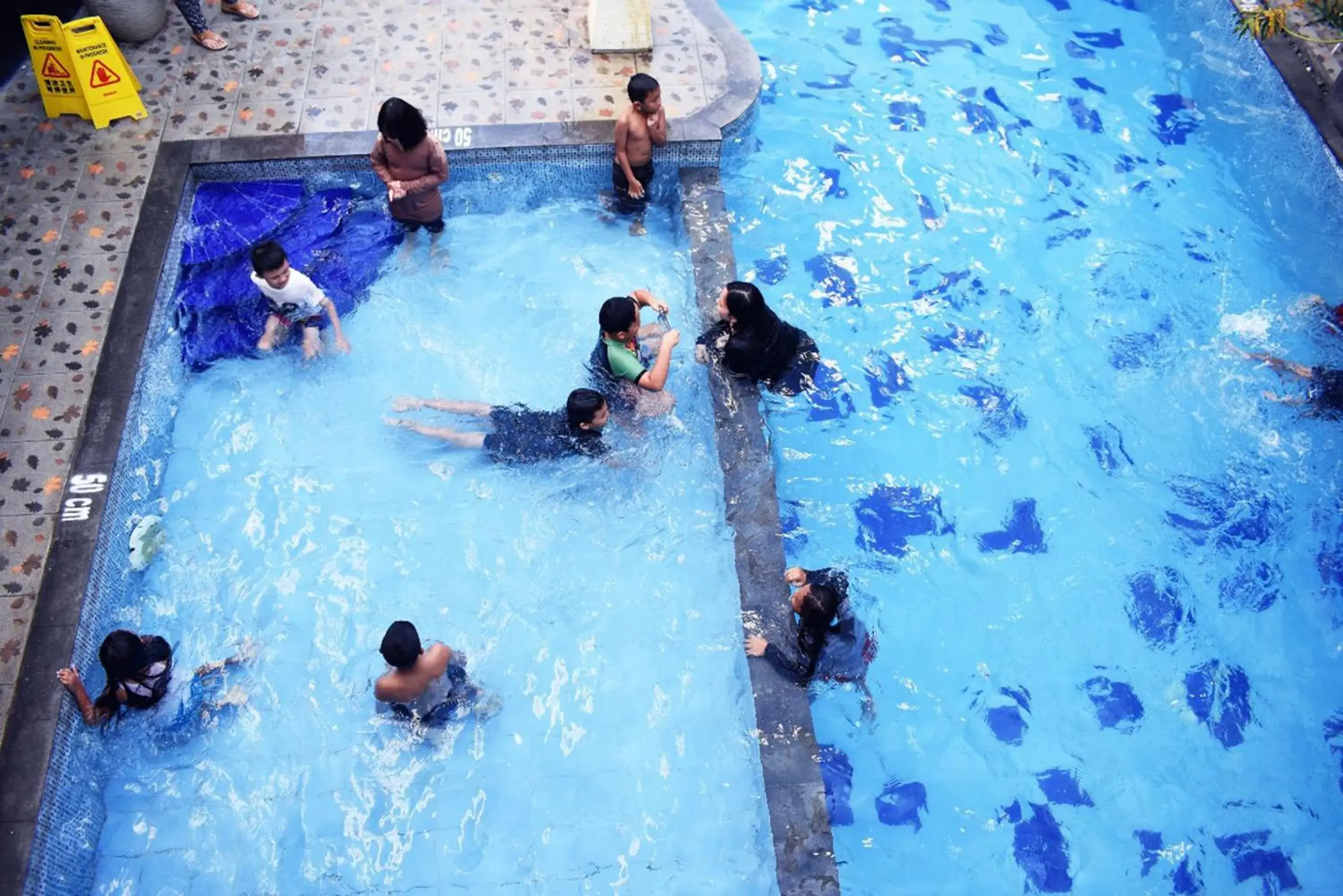 Swimming pool, Guests in Abadi Hotel Malioboro Yogyakarta by Tritama Hospitality