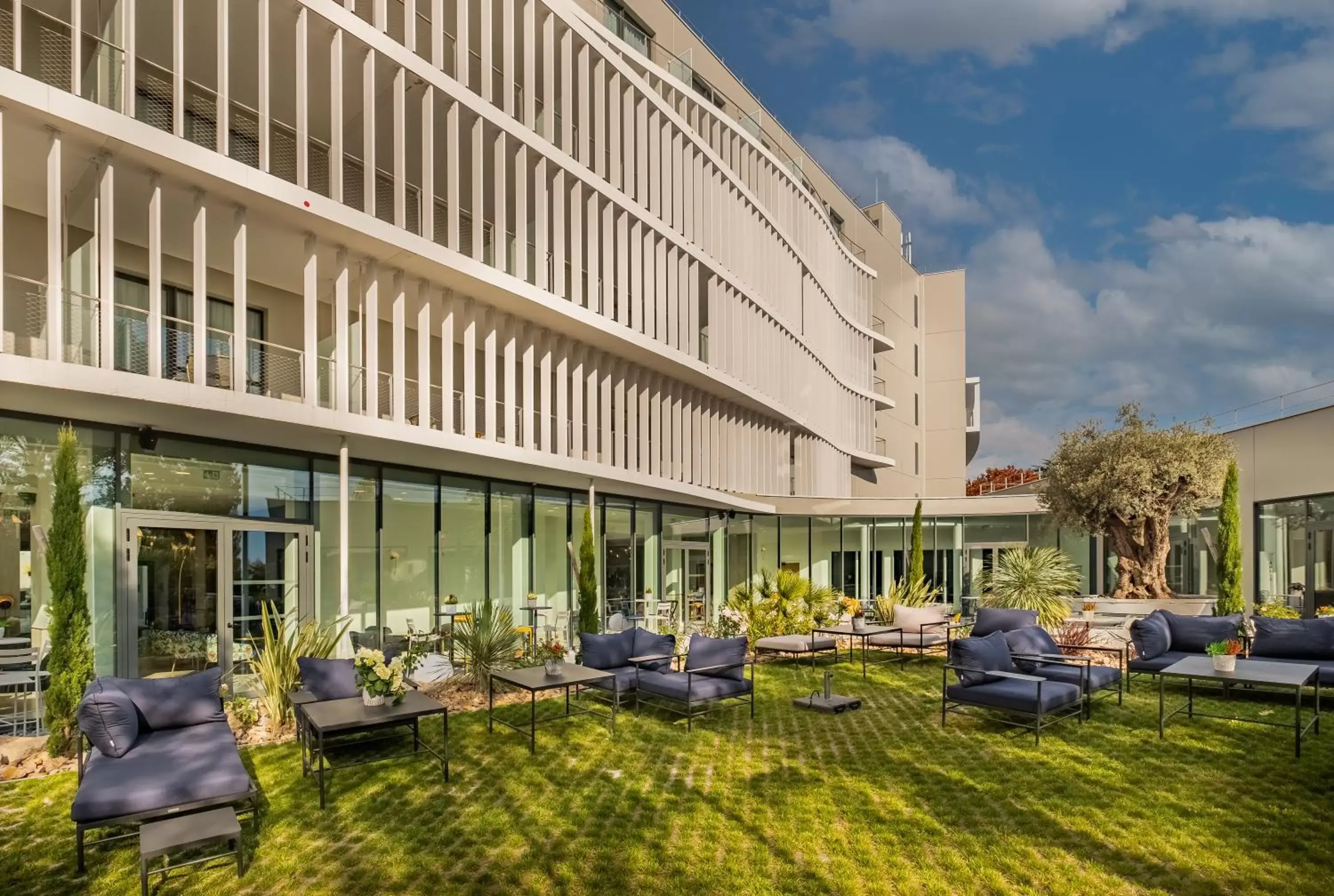 Patio, Property Building in GOLDEN TULIP LYON OUEST TECHLID Hotel & Spa