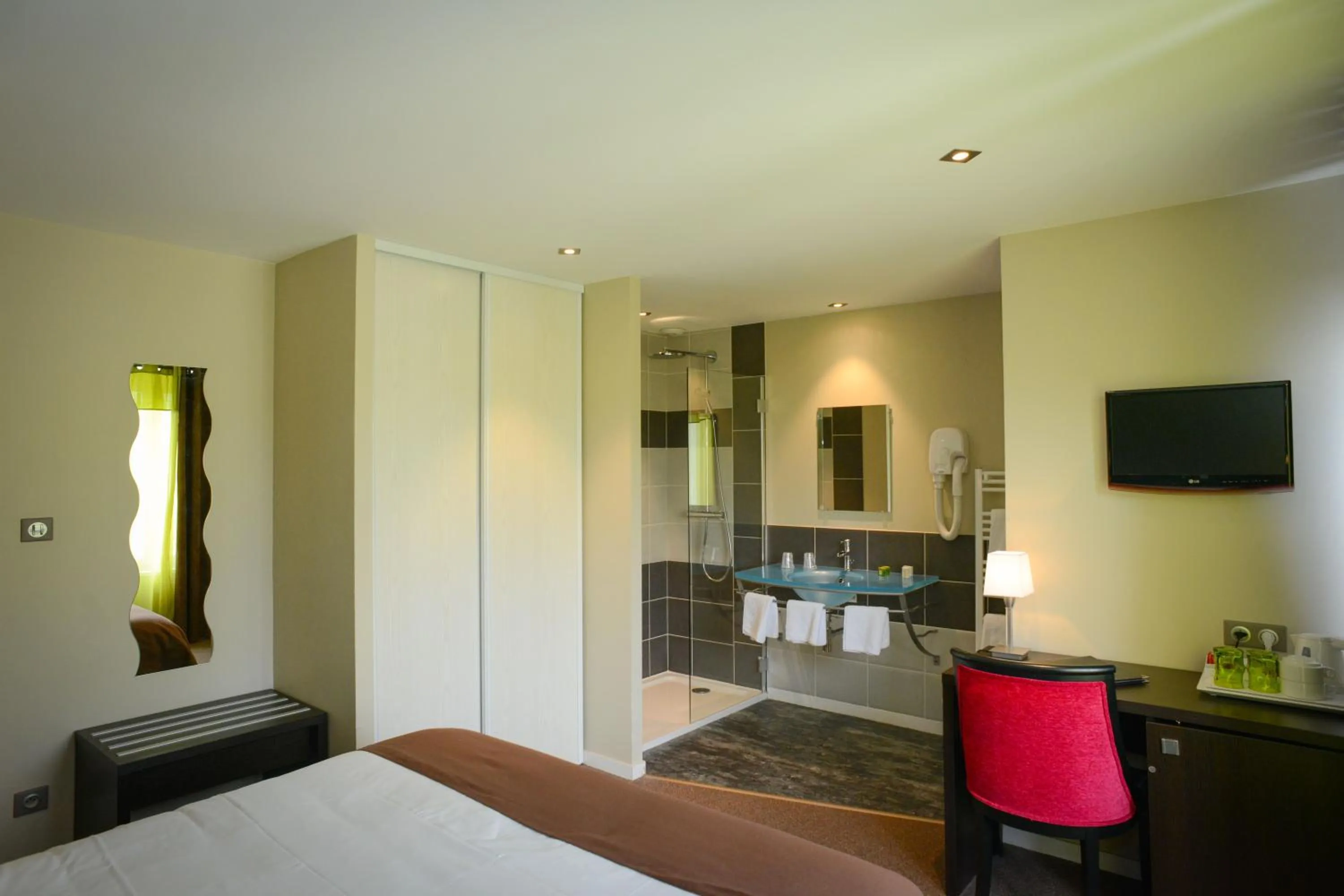 Seating area, Bed in Logis Hôtel Restaurant l'Auberge Normande