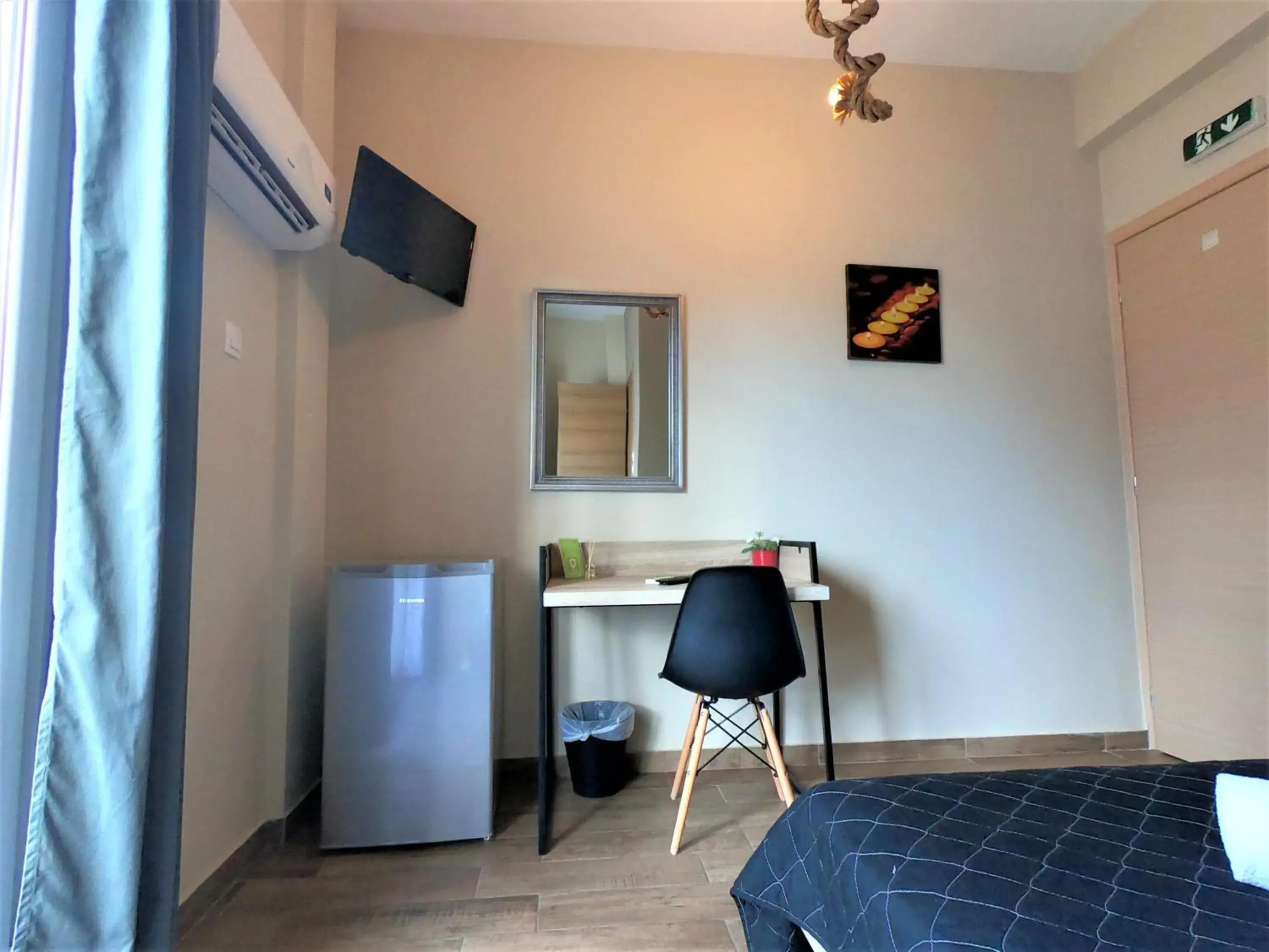 Bedroom, TV/Entertainment Center in Achillion Hotel Piraeus