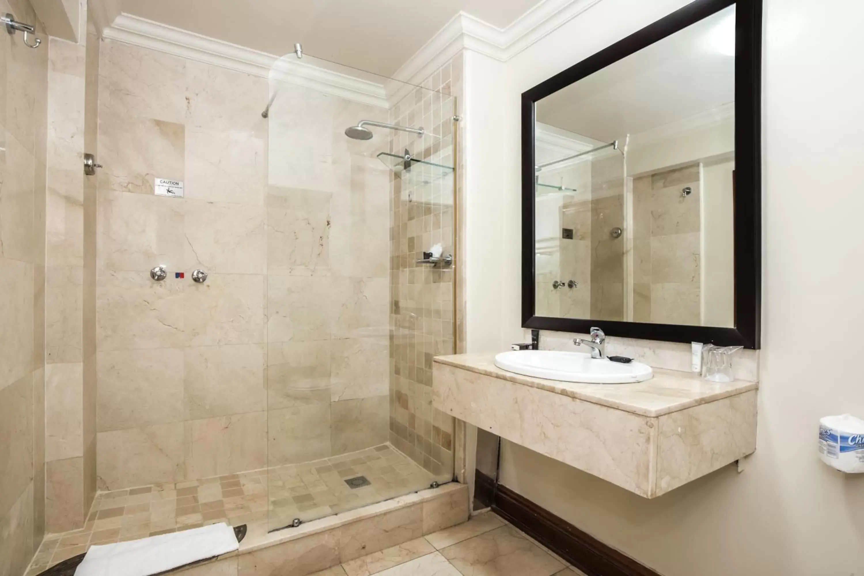 Bathroom in Belaire Suites Hotel