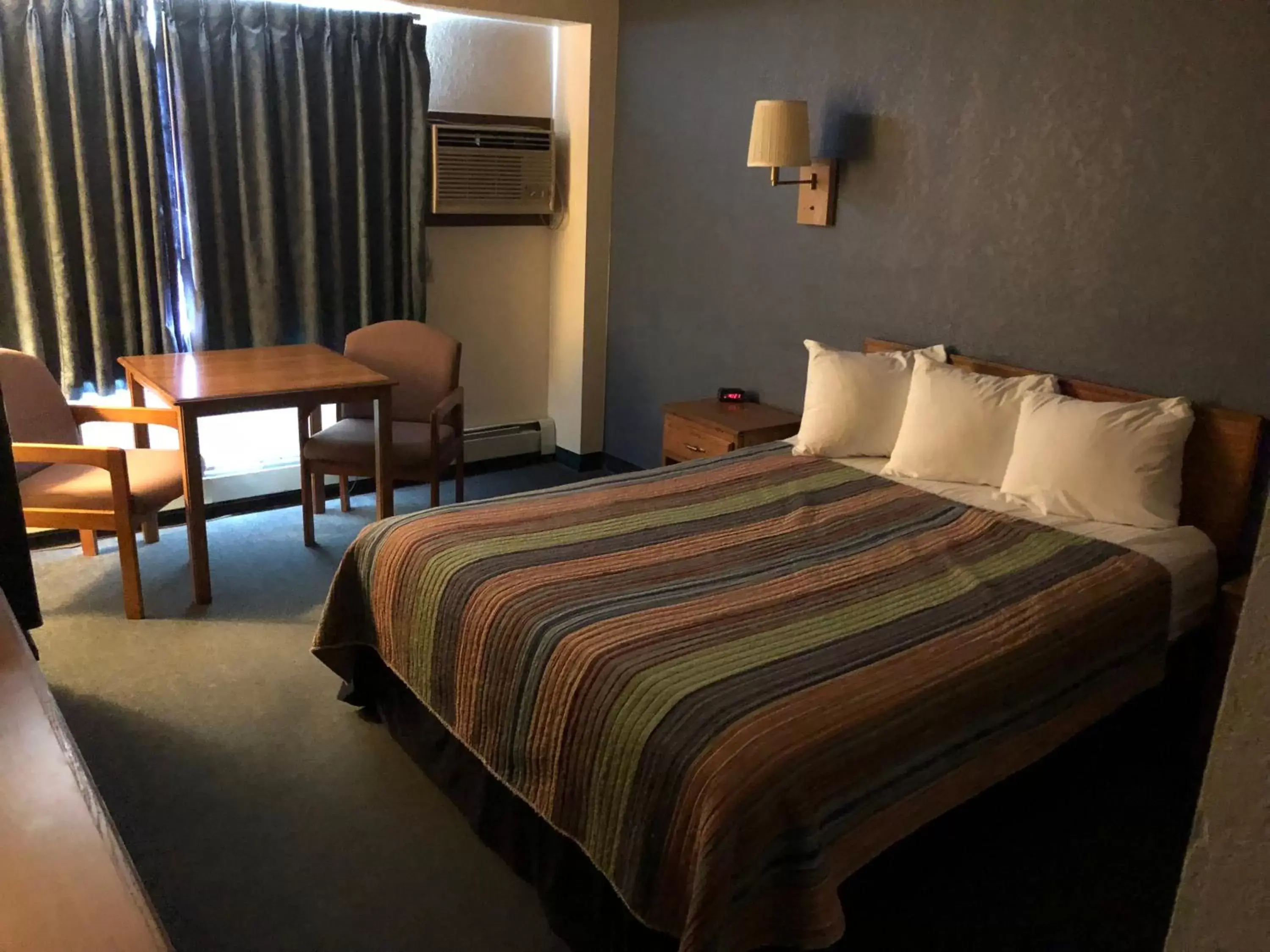 Bed in AmericInn Motel - Monticello