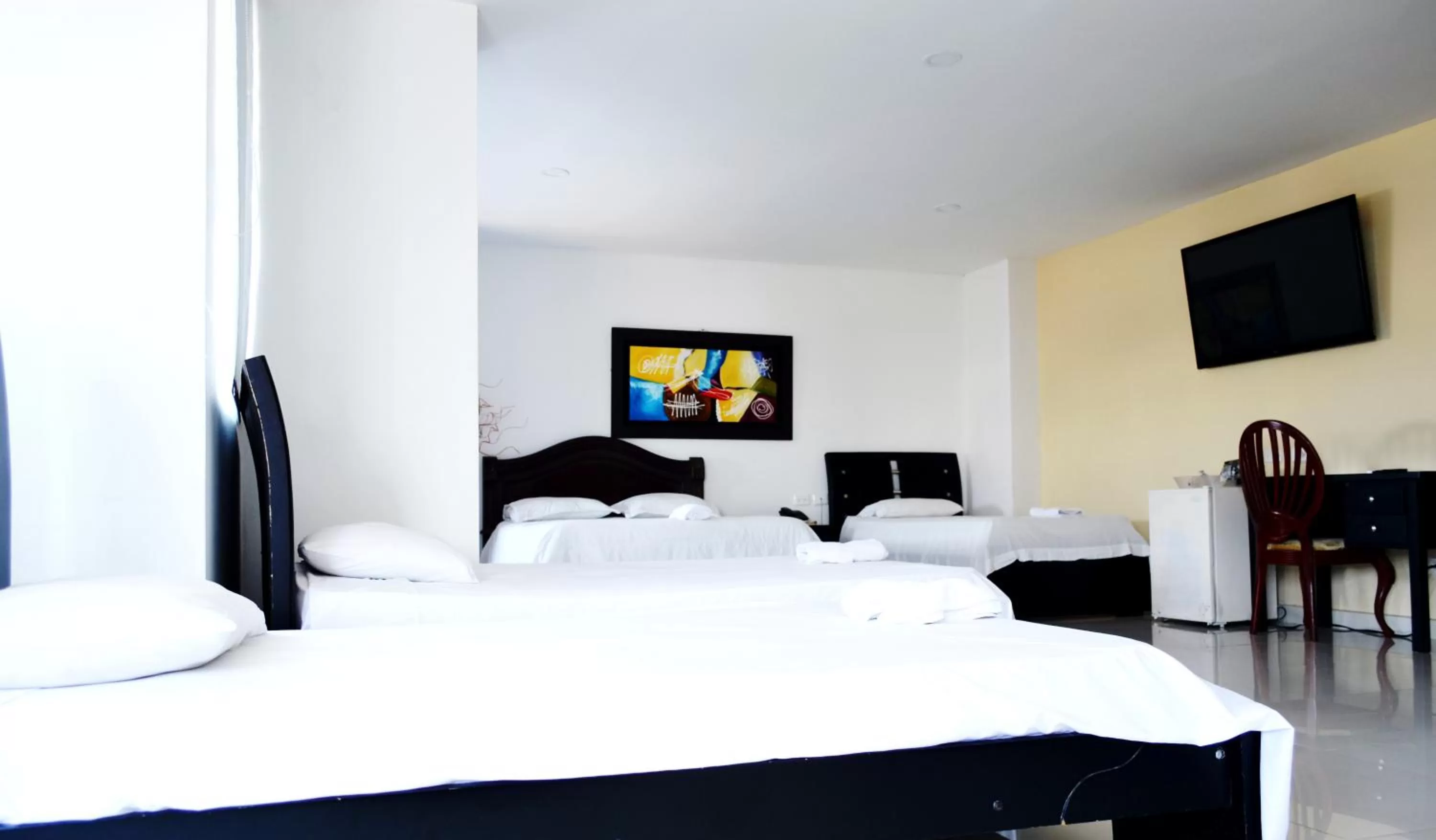 Bed in Hotel Intersuites