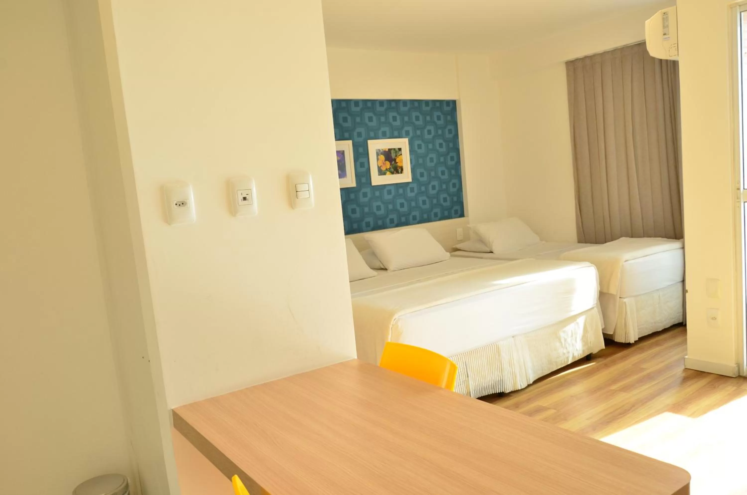 Bed in Unico Apart Hotel