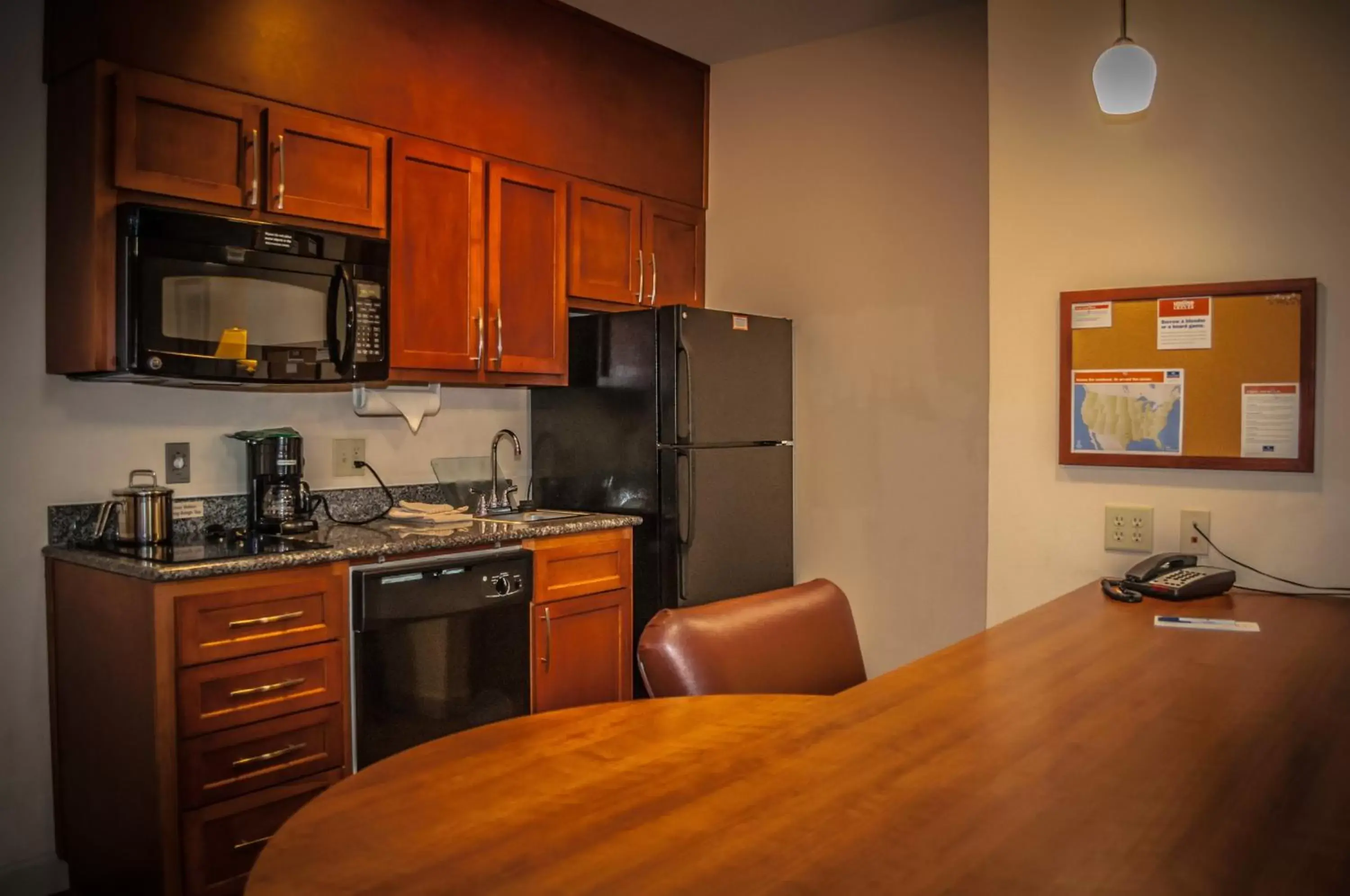 Photo of the whole room, Kitchen/Kitchenette in Candlewood Suites New Iberia, an IHG Hotel