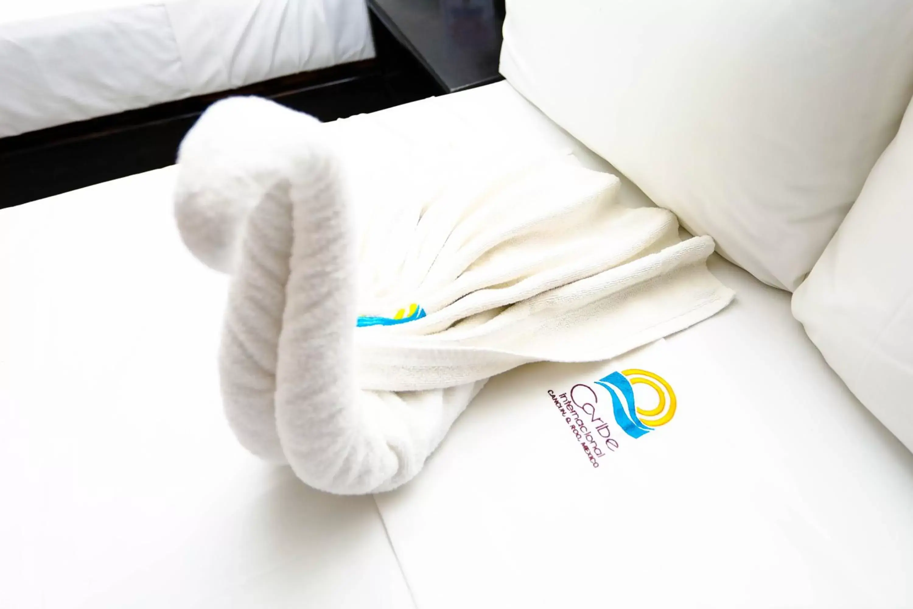 towels, Bed in Hotel Caribe Internacional Cancun