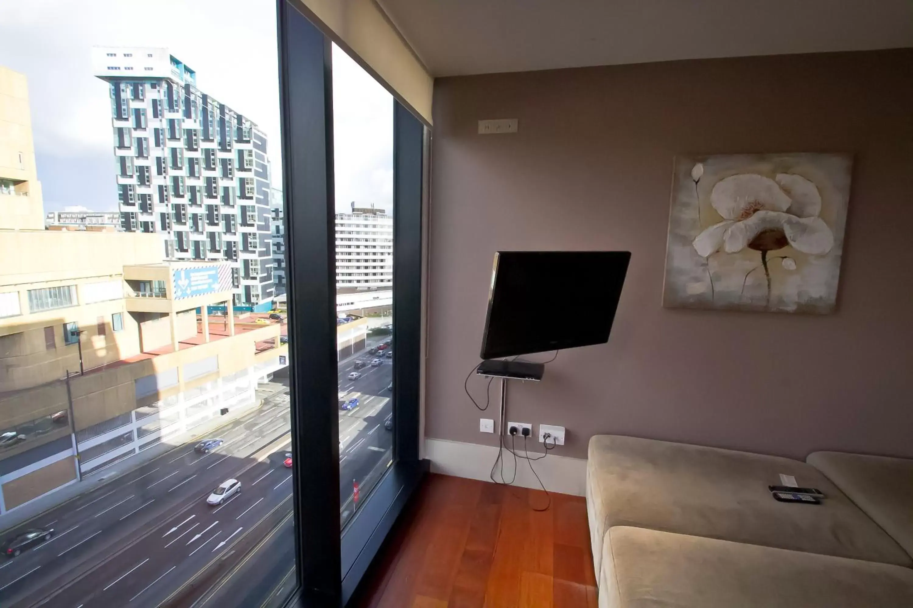 Living room, TV/Entertainment Center in Merchant Quarters Apartments