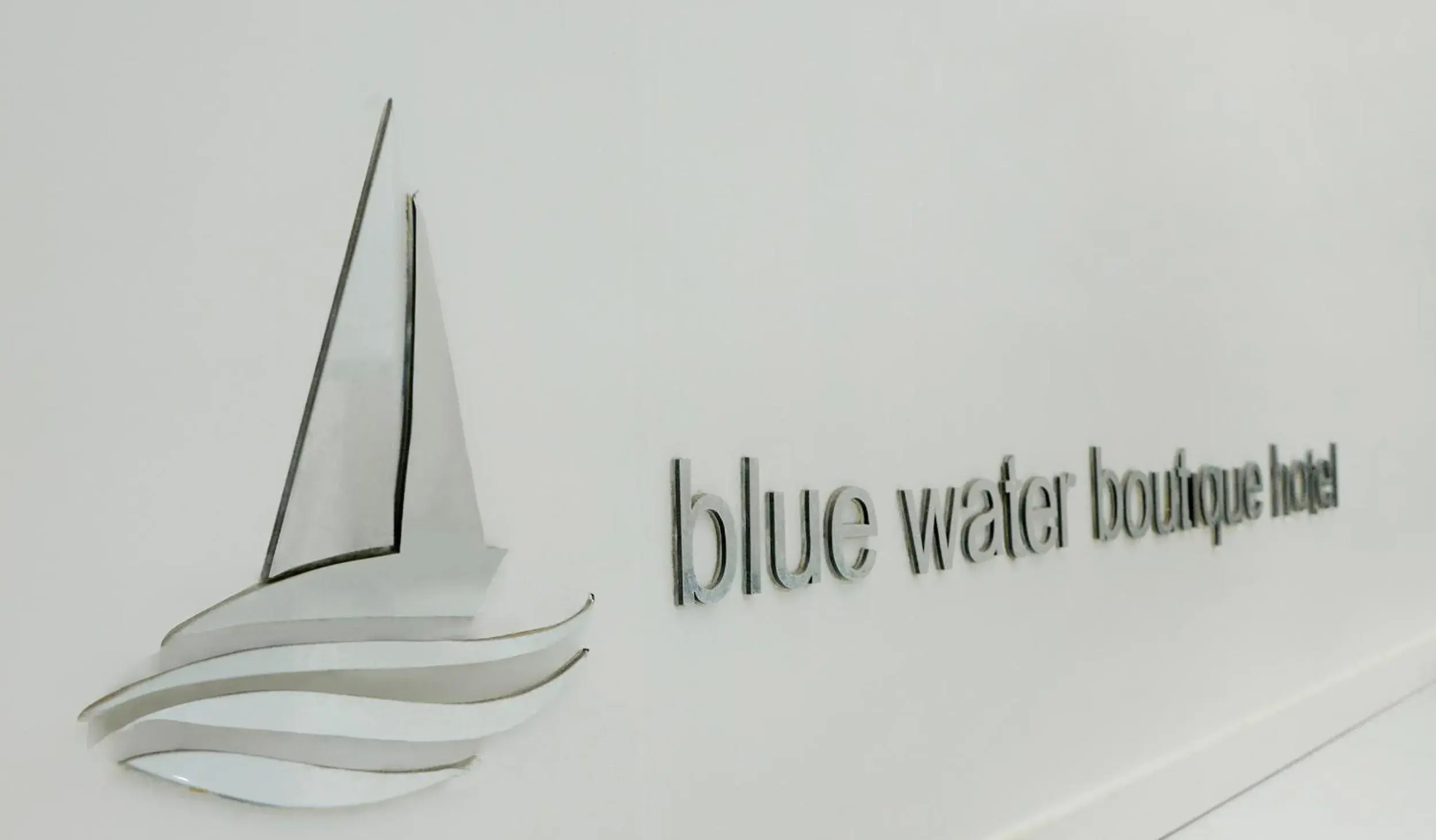 Lobby or reception, Property Logo/Sign in Blue Water Boutique Hotel