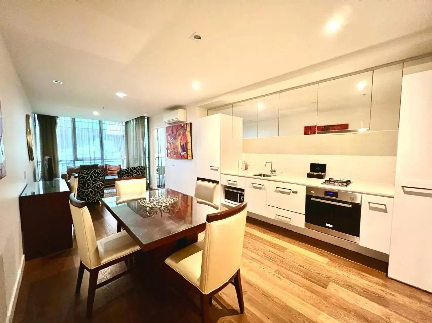 Living room, Kitchen/Kitchenette in The Sebel Residences Melbourne Docklands Serviced Apartments