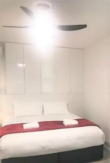 Bed in Sunrise Luxury Apartments