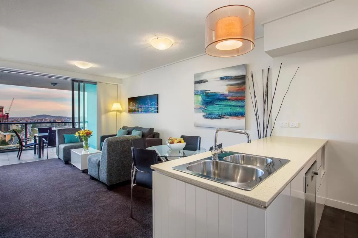 Kitchen or kitchenette in Evolution Apartments