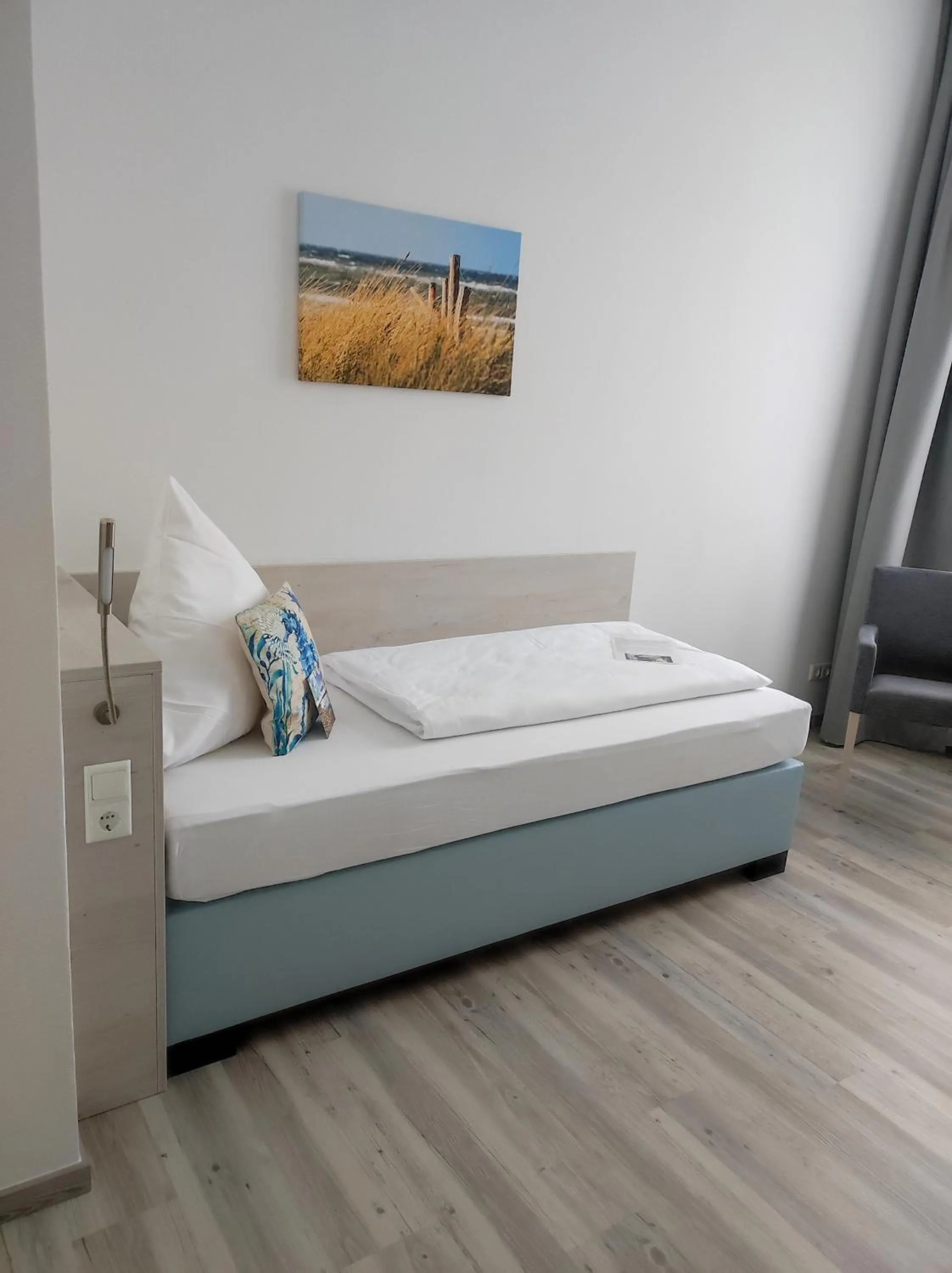 Photo of the whole room, Bed in Nordsee Hotel Borkum