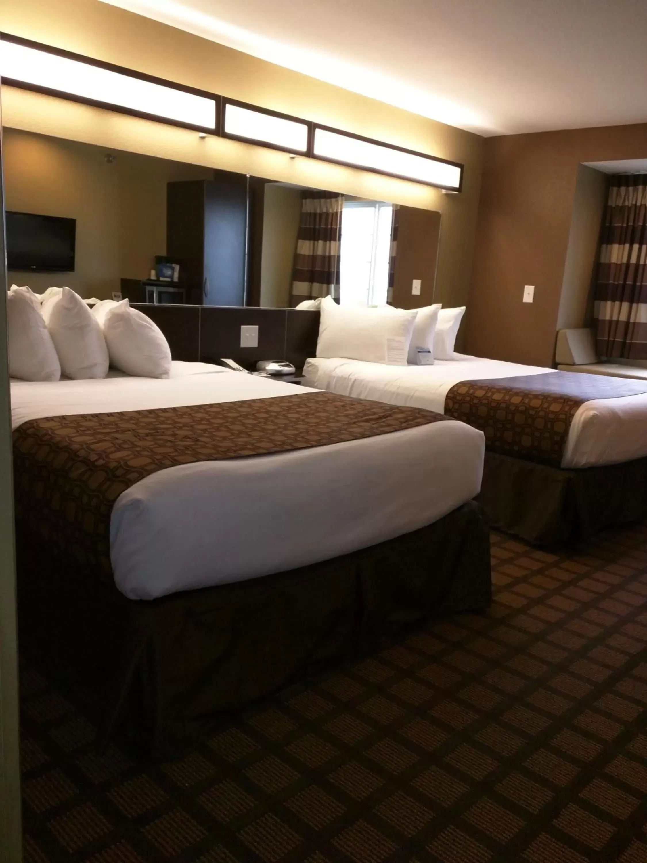 Photo of the whole room, Bed in Microtel Inn & Suites by Wyndham Minot