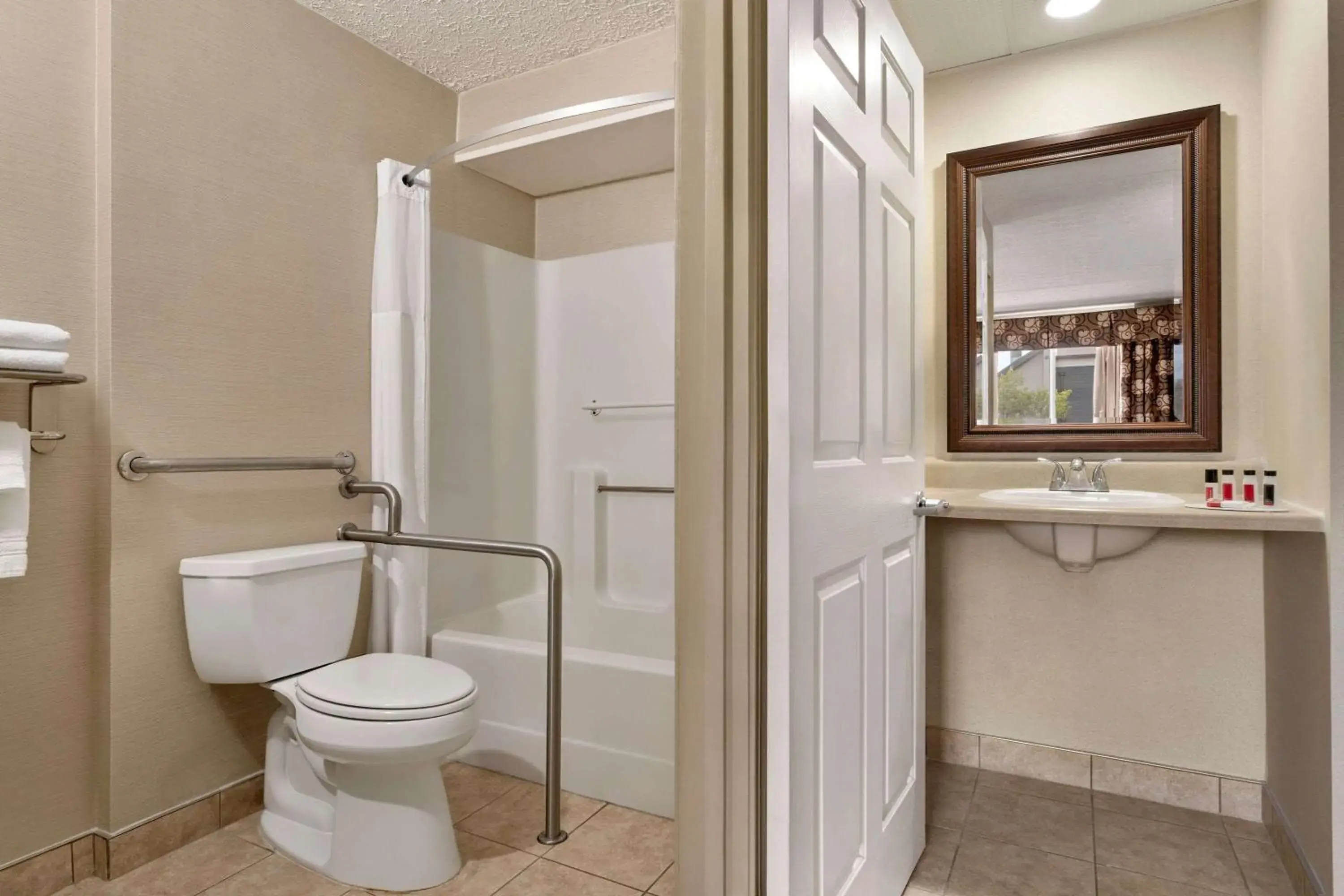 Bathroom in Days Inn by Wyndham Airport/Maine Mall
