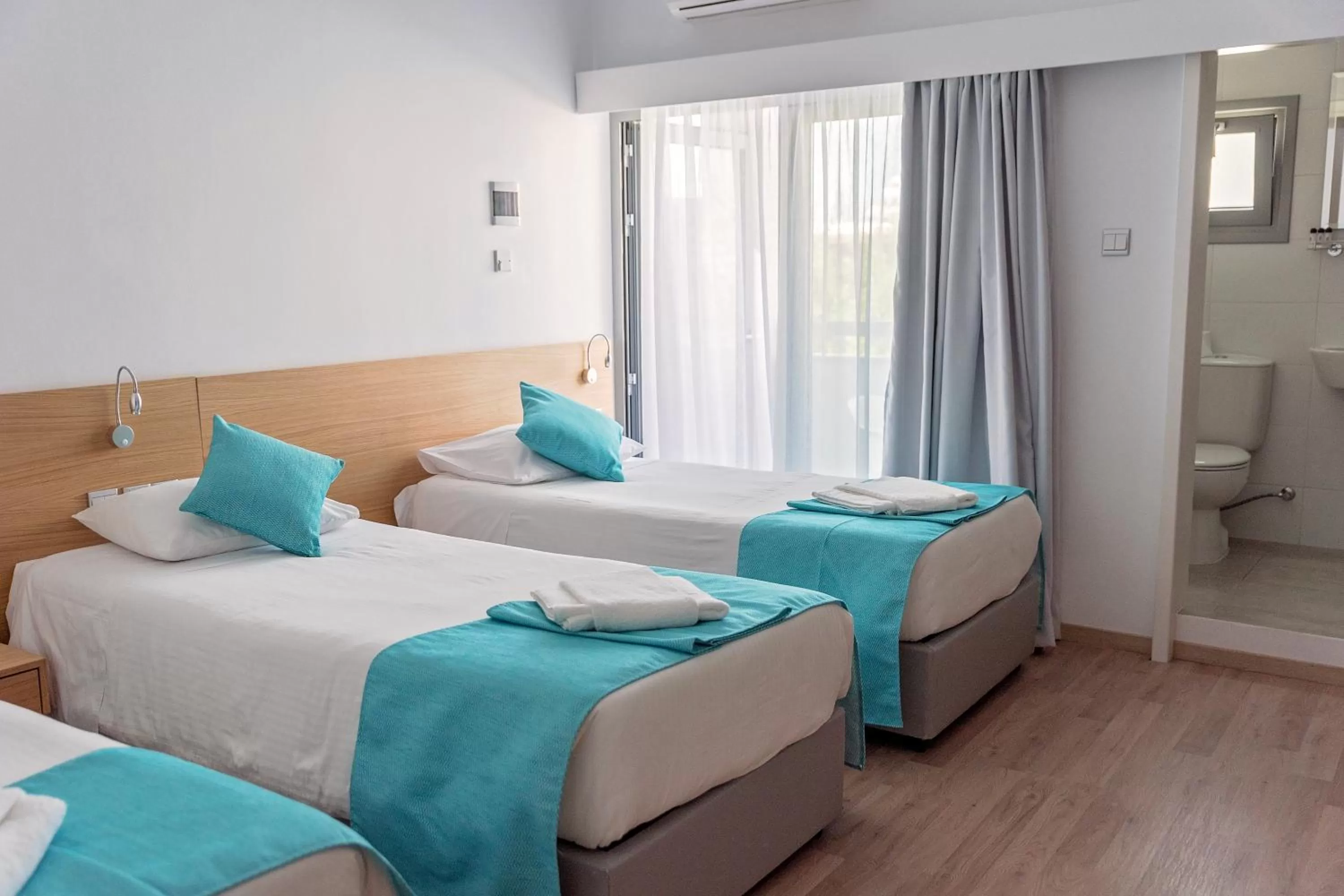 Bed in Pyramos Hotel