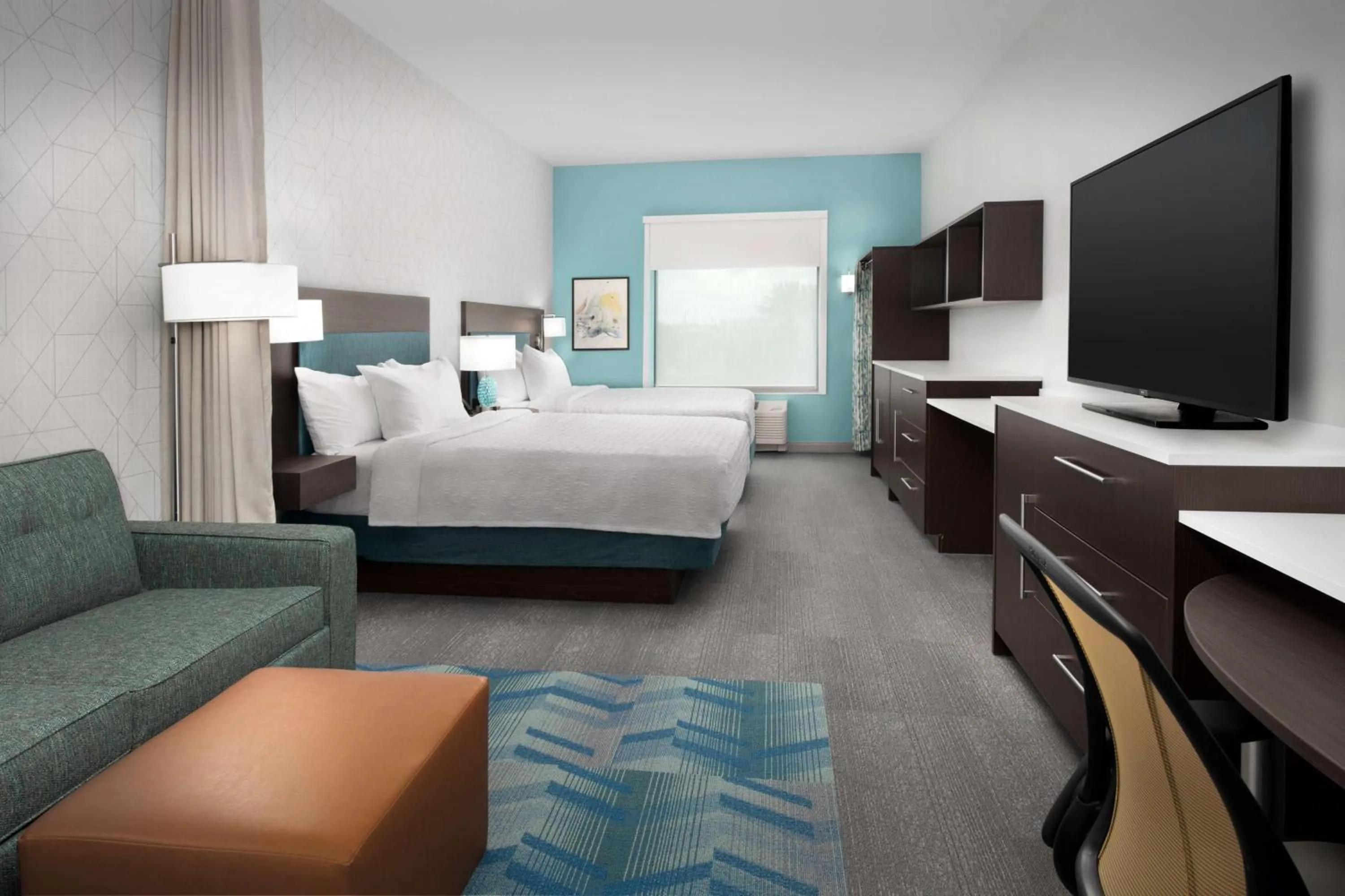 Living room, Bed in Home2 Suites Orlando Southeast Nona