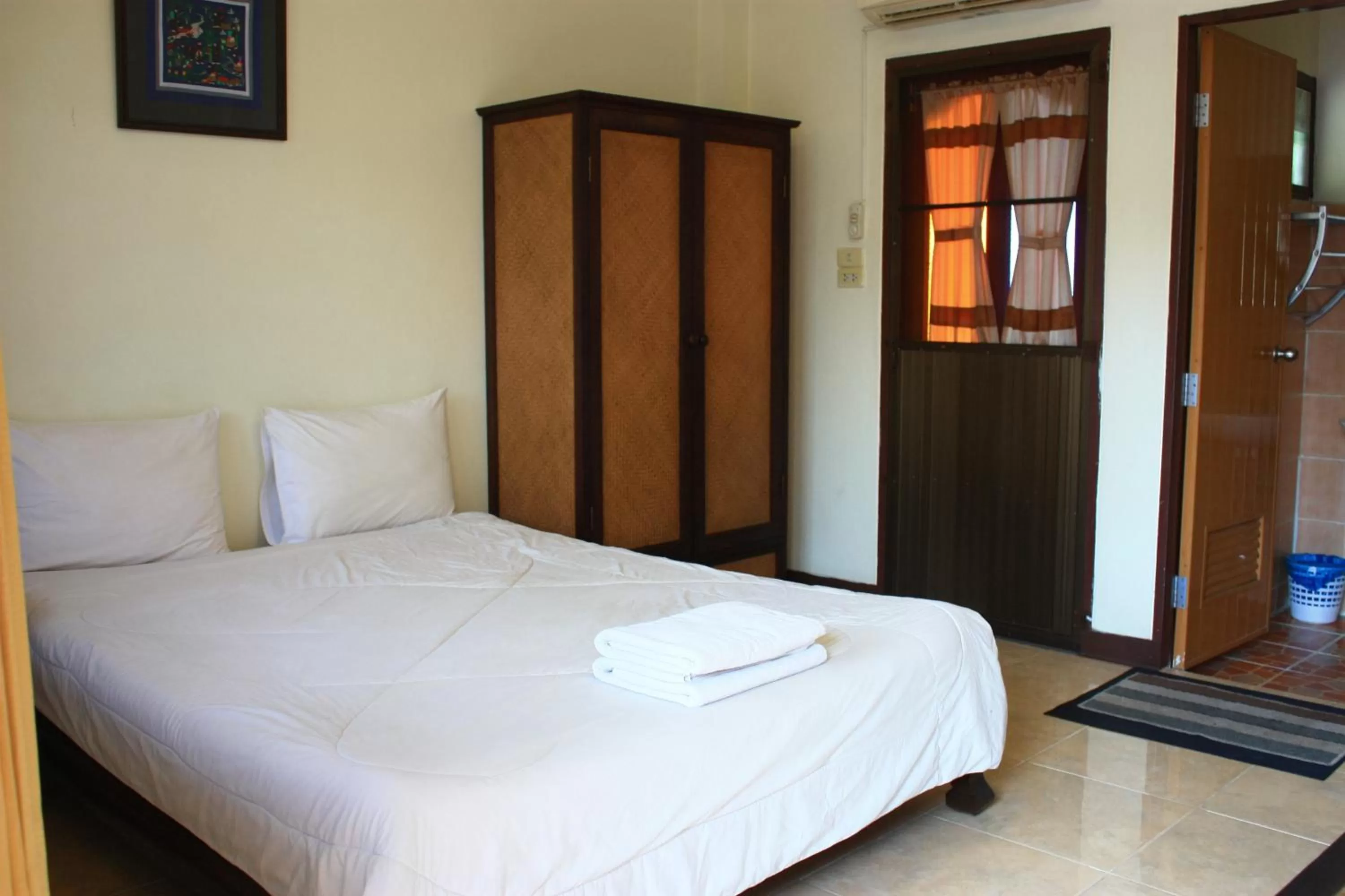 Bed in โรงแรมตีฆ้อง - Tri Gong Hotel