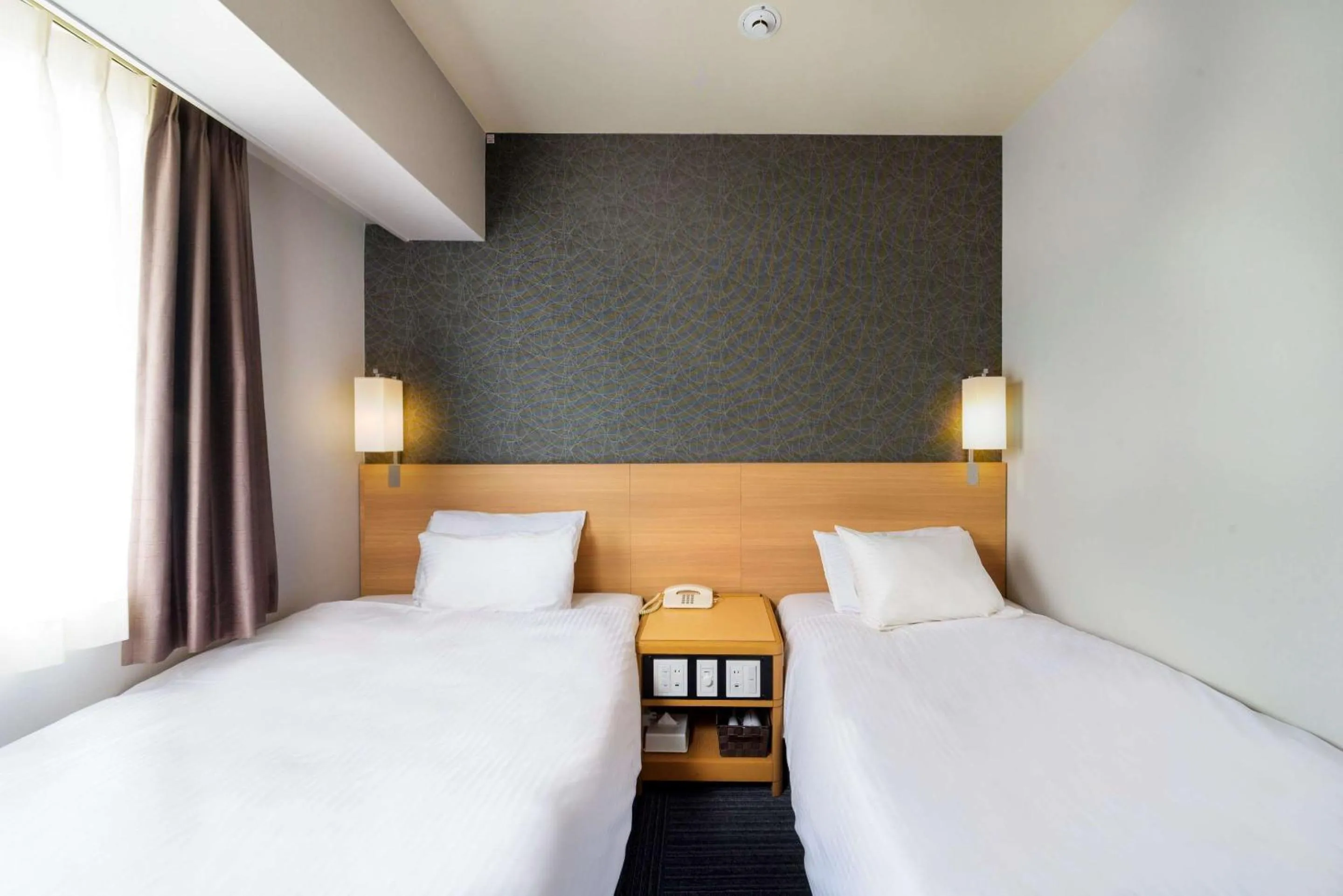 Bedroom in SureStay Plus Hotel by Best Western Shin-Osaka