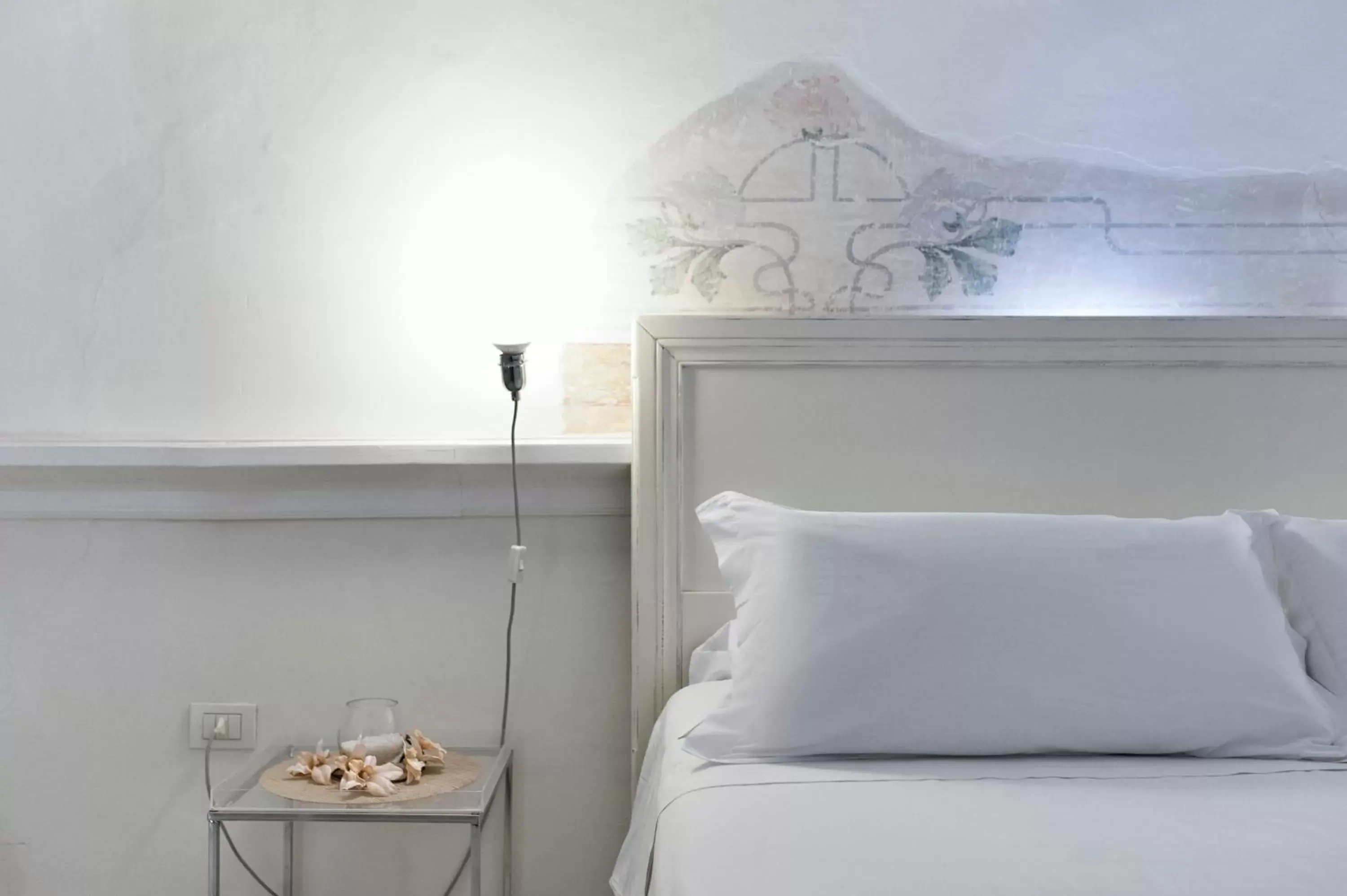 Bed in Casa di Lo Suites