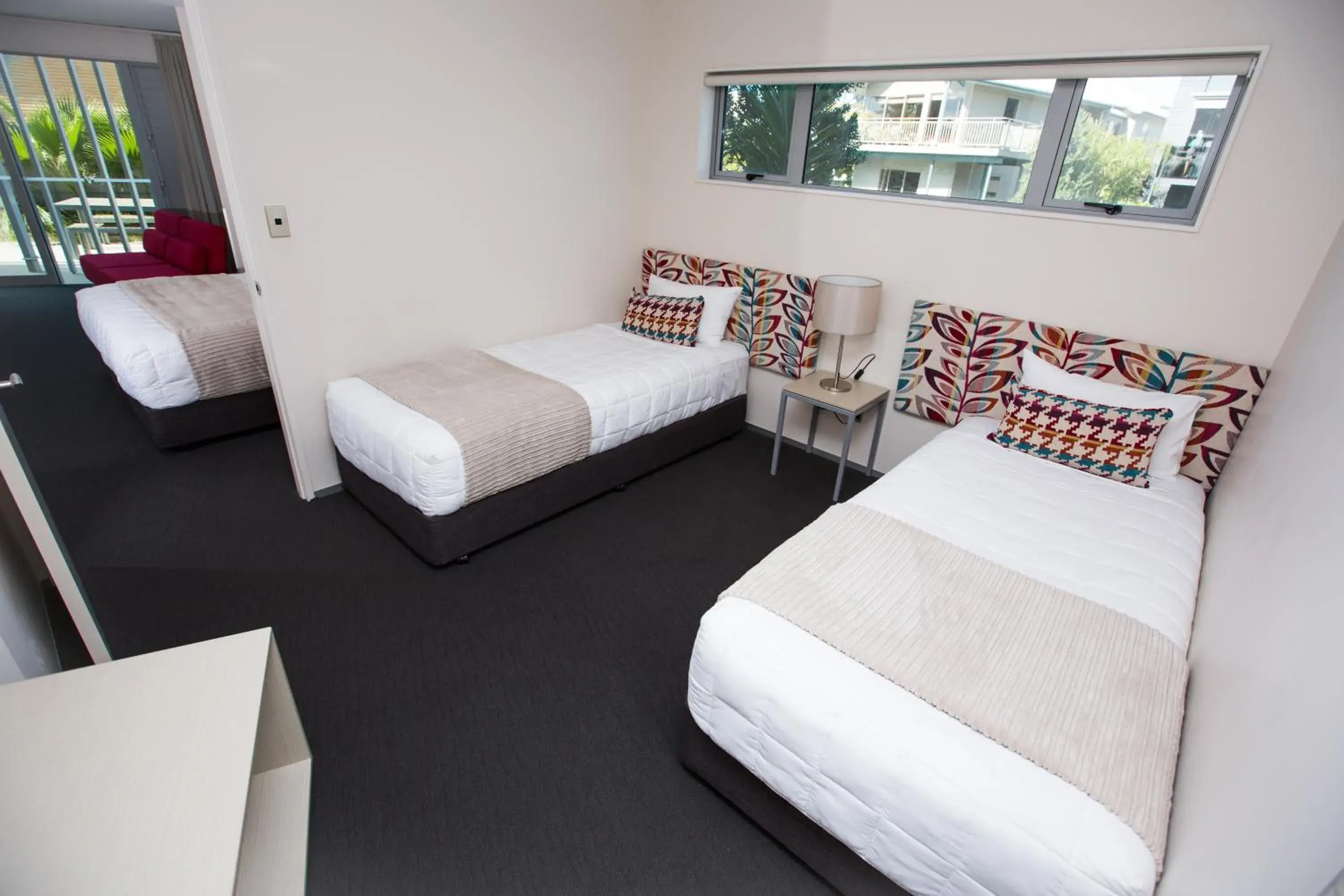 Bed in Navigate Seaside Hotel & Apartments