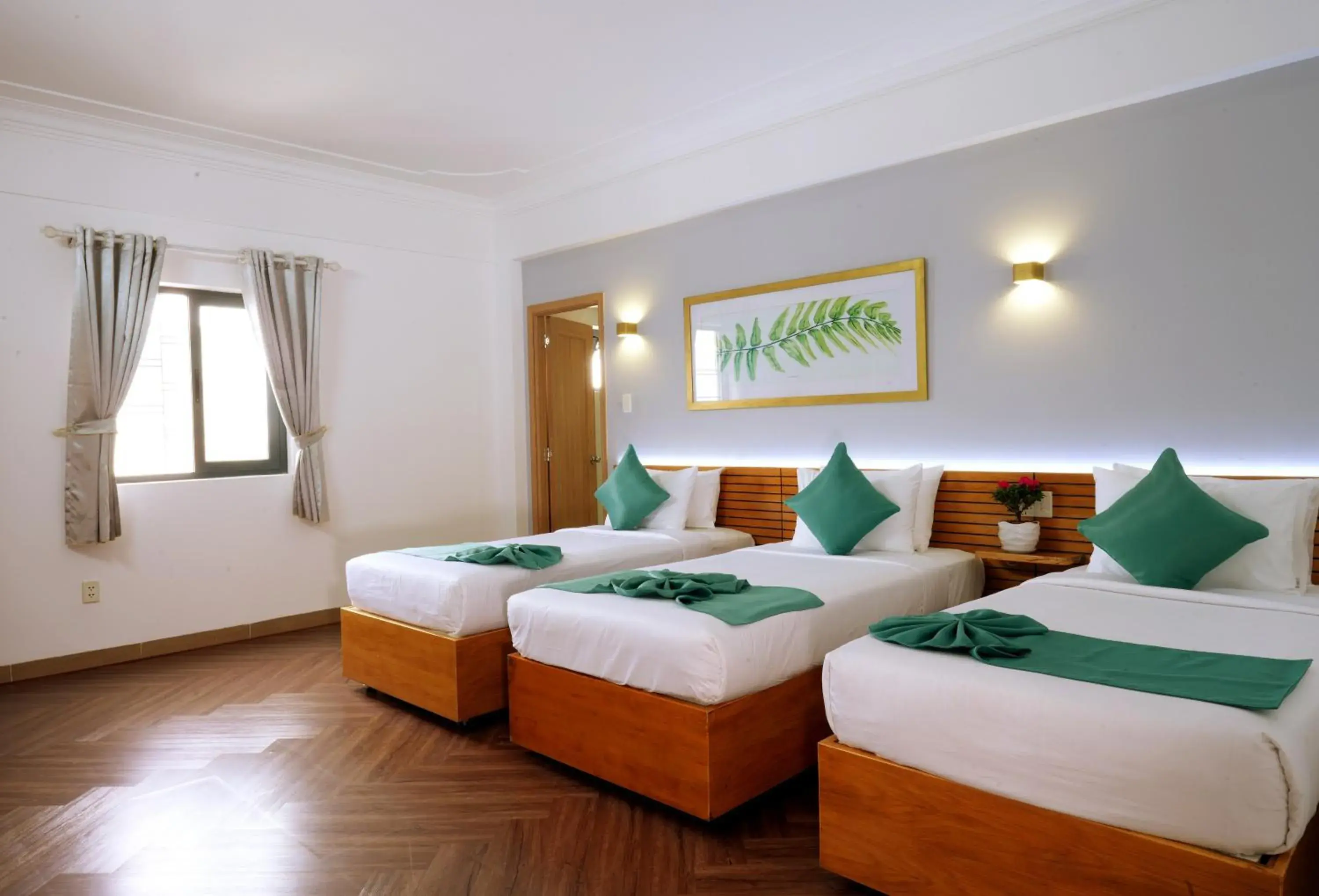 Family Room with Window in Sunshine Antique Hotel Saigon Family Room with Window in Sunshine Antique Hotel Saigon