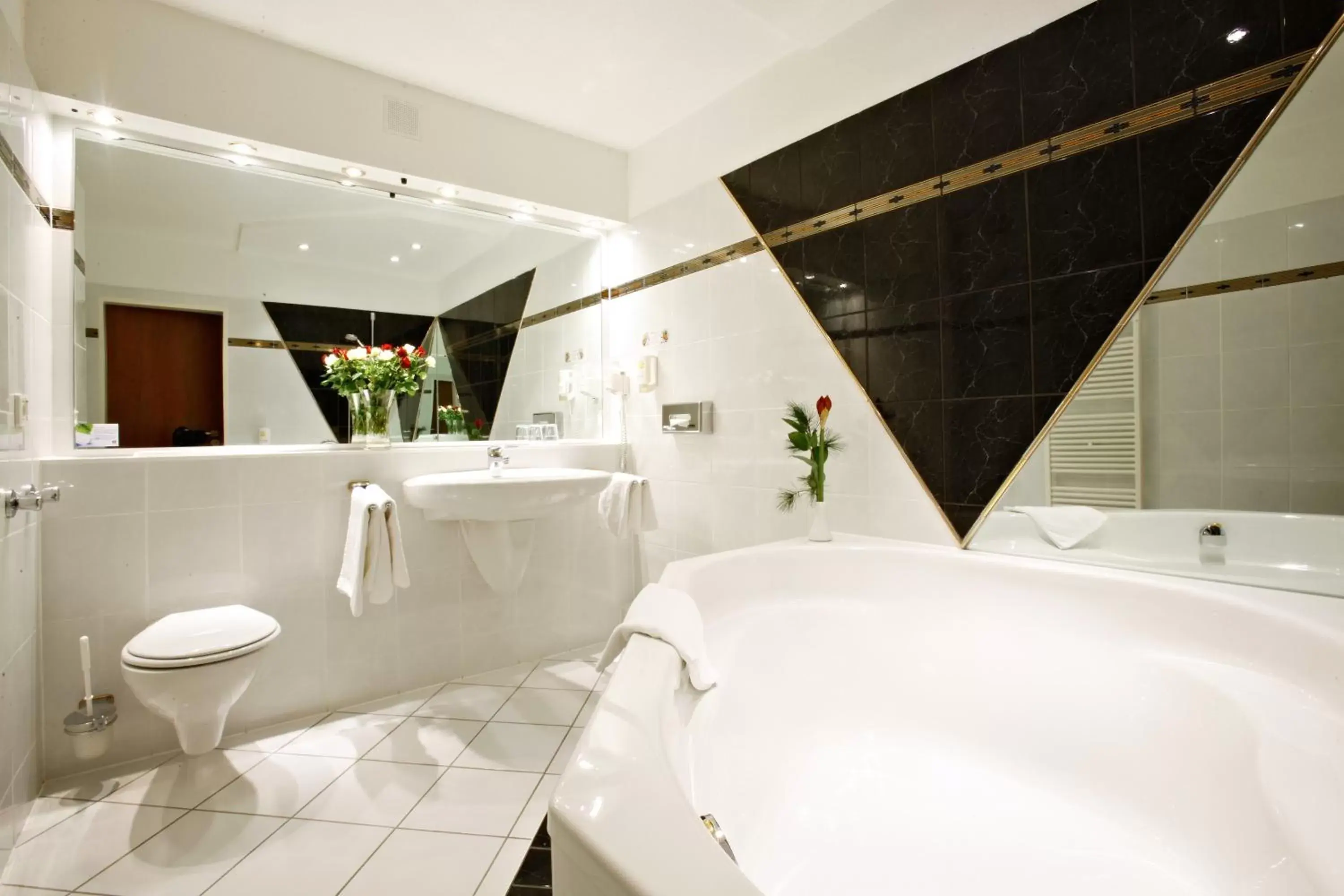 Bathroom in Hotel Plöner See by Tulip Inn