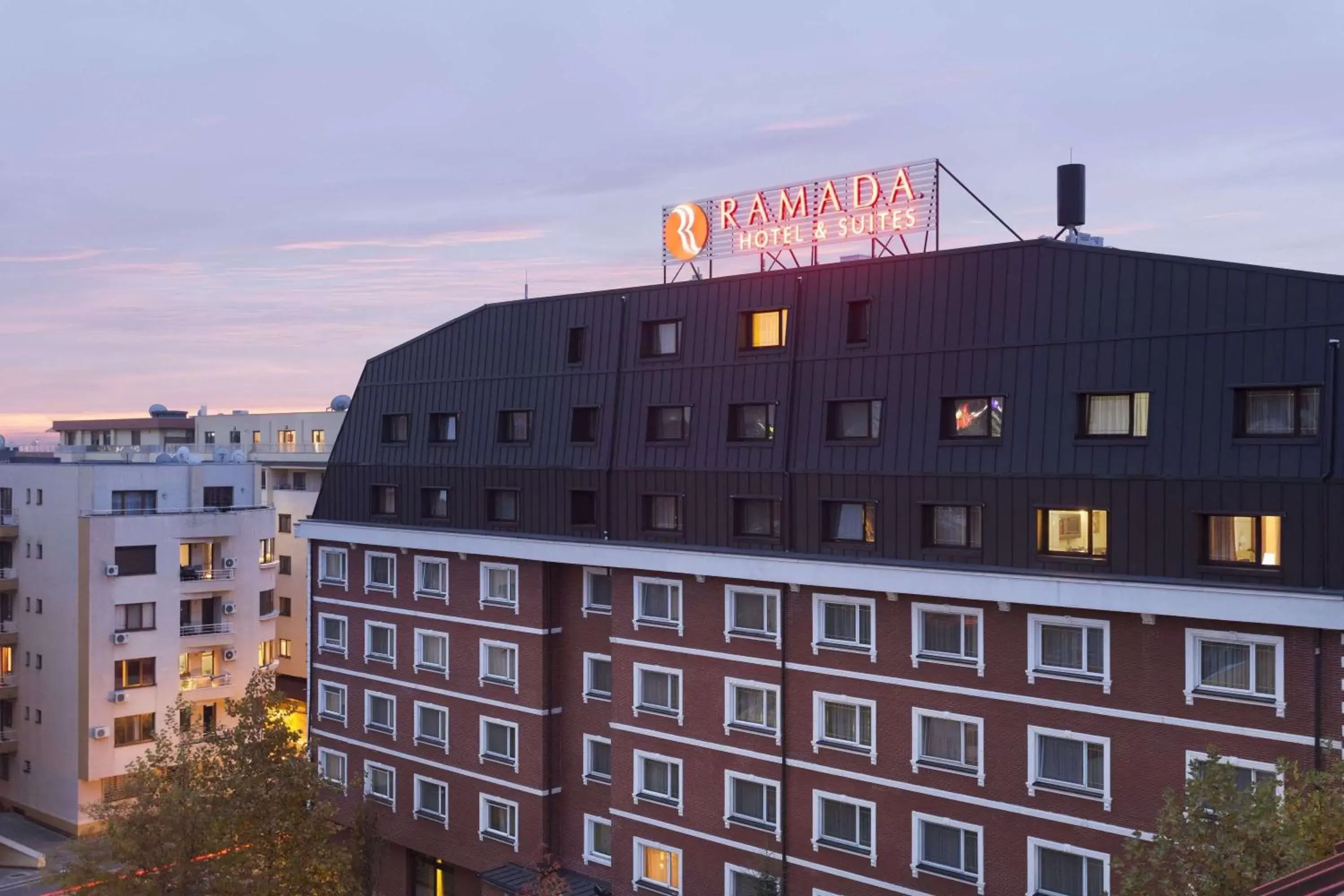Property building in Ramada Hotel & Suites by Wyndham Bucharest North
