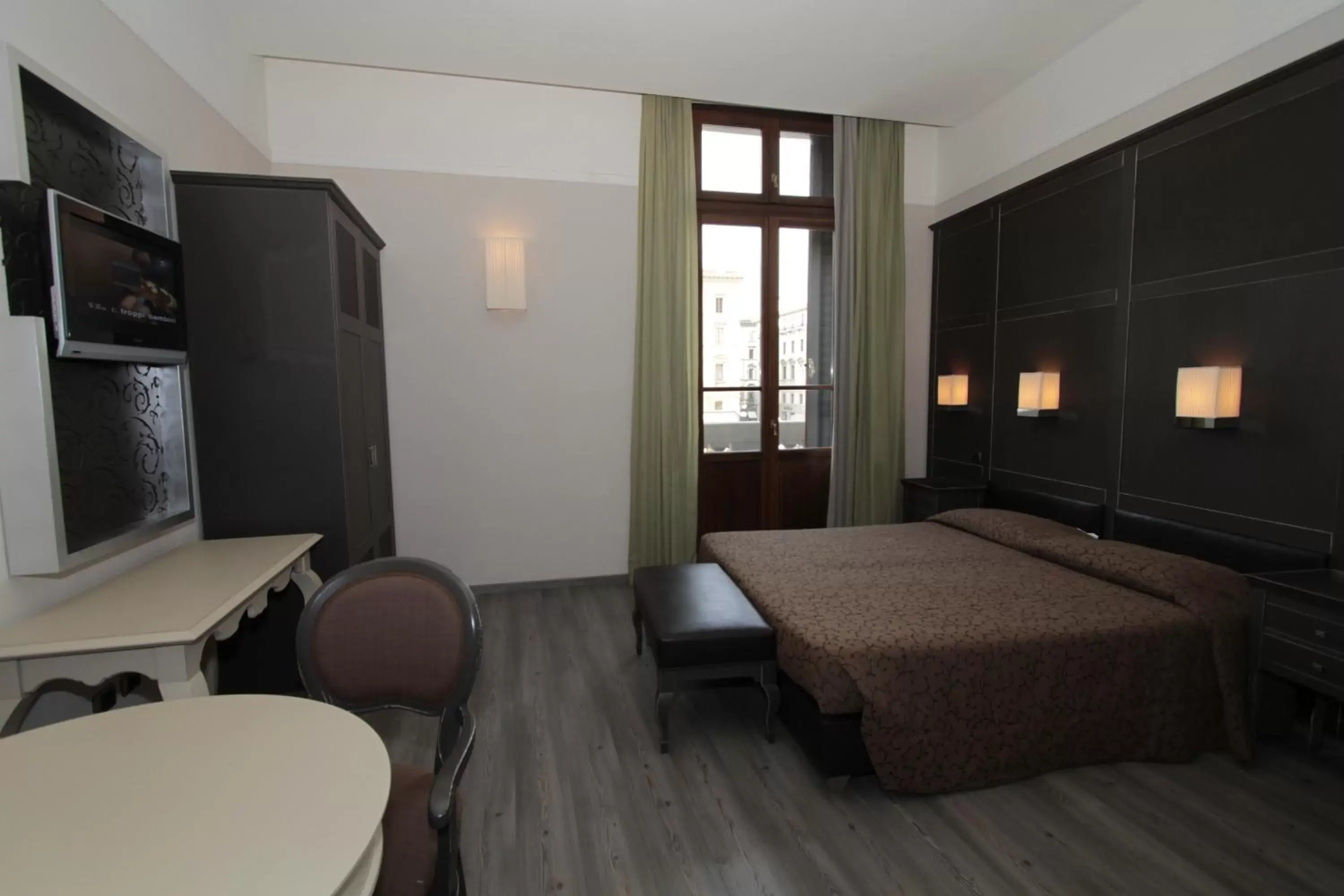 Bedroom, TV/Entertainment Center in Residence La Repubblica